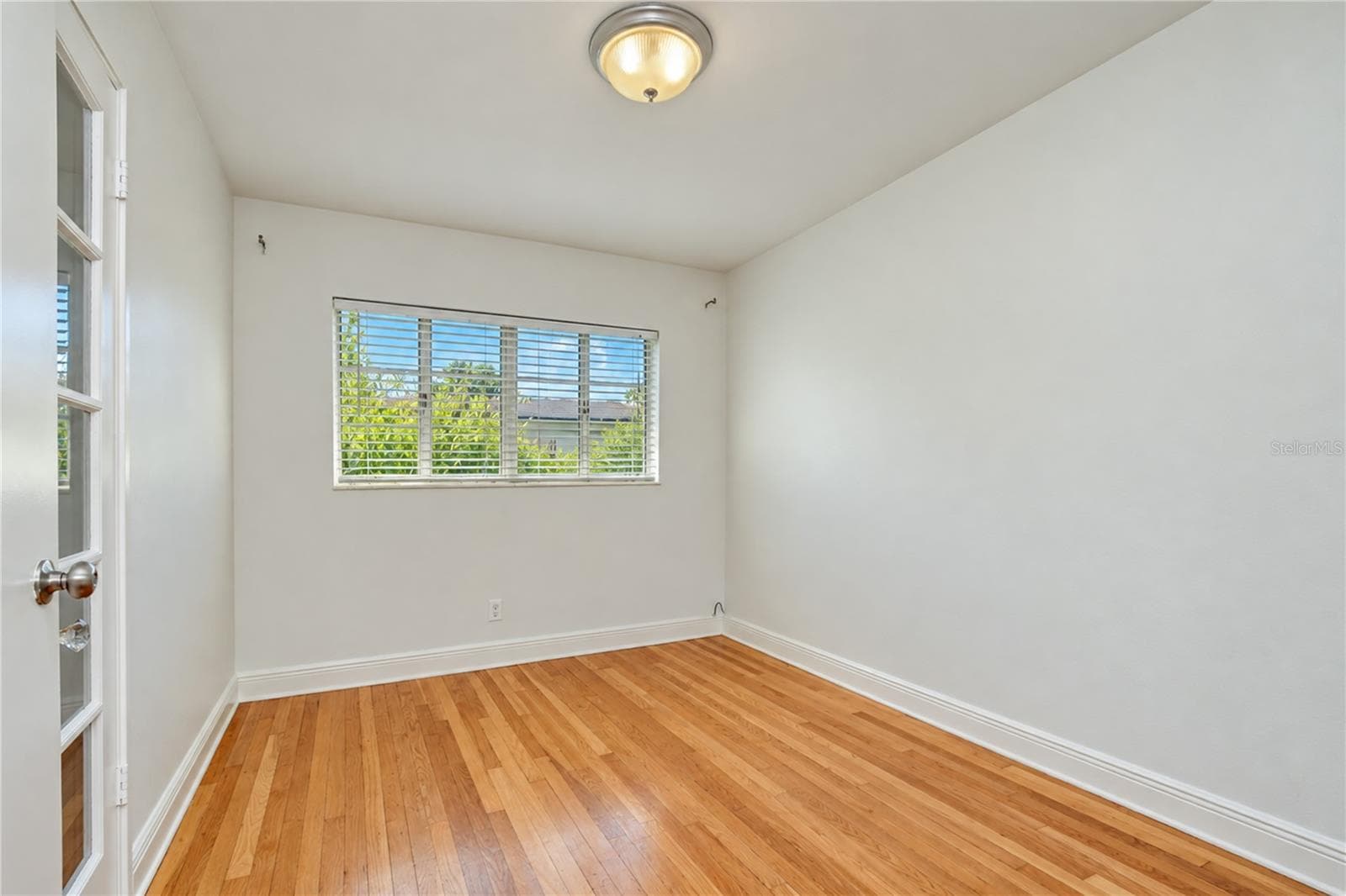 Bright and spacious interior room featuring clean finishes, abundant natural light, and smooth flow into the home. - 4508 S LOIS AVE, TAMPA