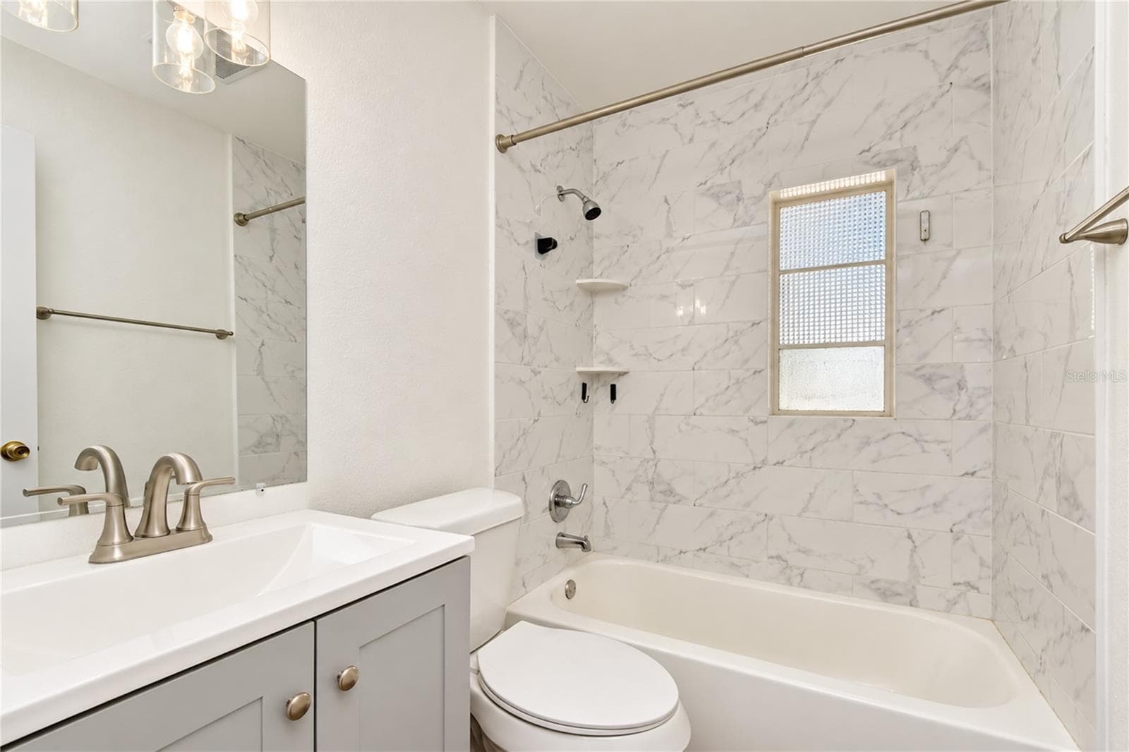 Updated finishes give the bathroom a fresh, modern appearance. - 4508 S LOIS AVE, TAMPA