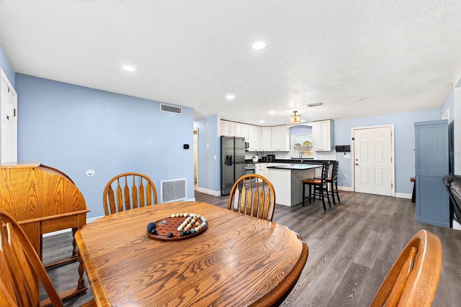The Dining Room is a welcoming space for daily dining or special gatherings. - 1444 KENNY CT, WINTER GARDEN