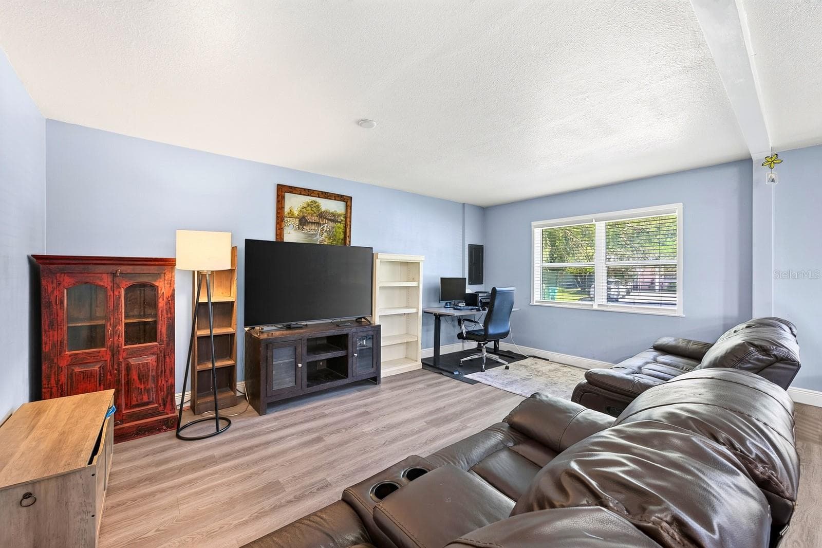 The Living Room provides a comfortable gathering space. - 1444 KENNY CT, WINTER GARDEN