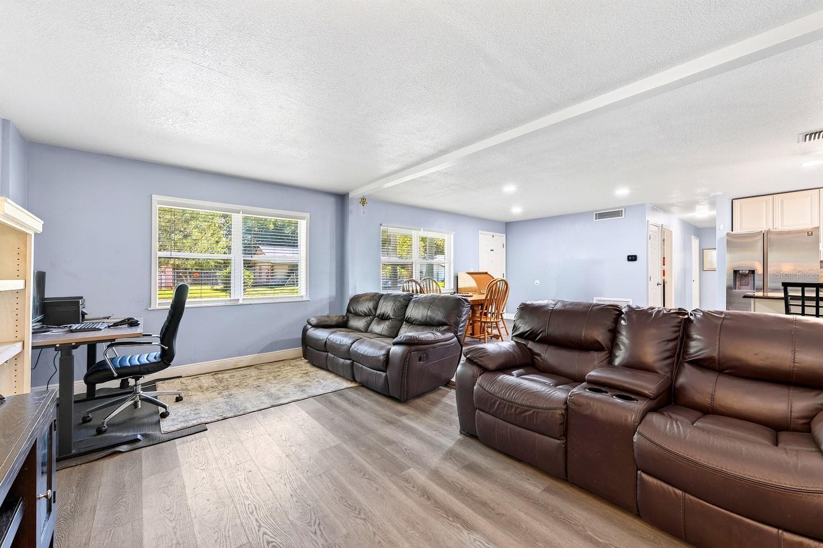 The Living Room provides a comfortable gathering space. - 1444 KENNY CT, WINTER GARDEN