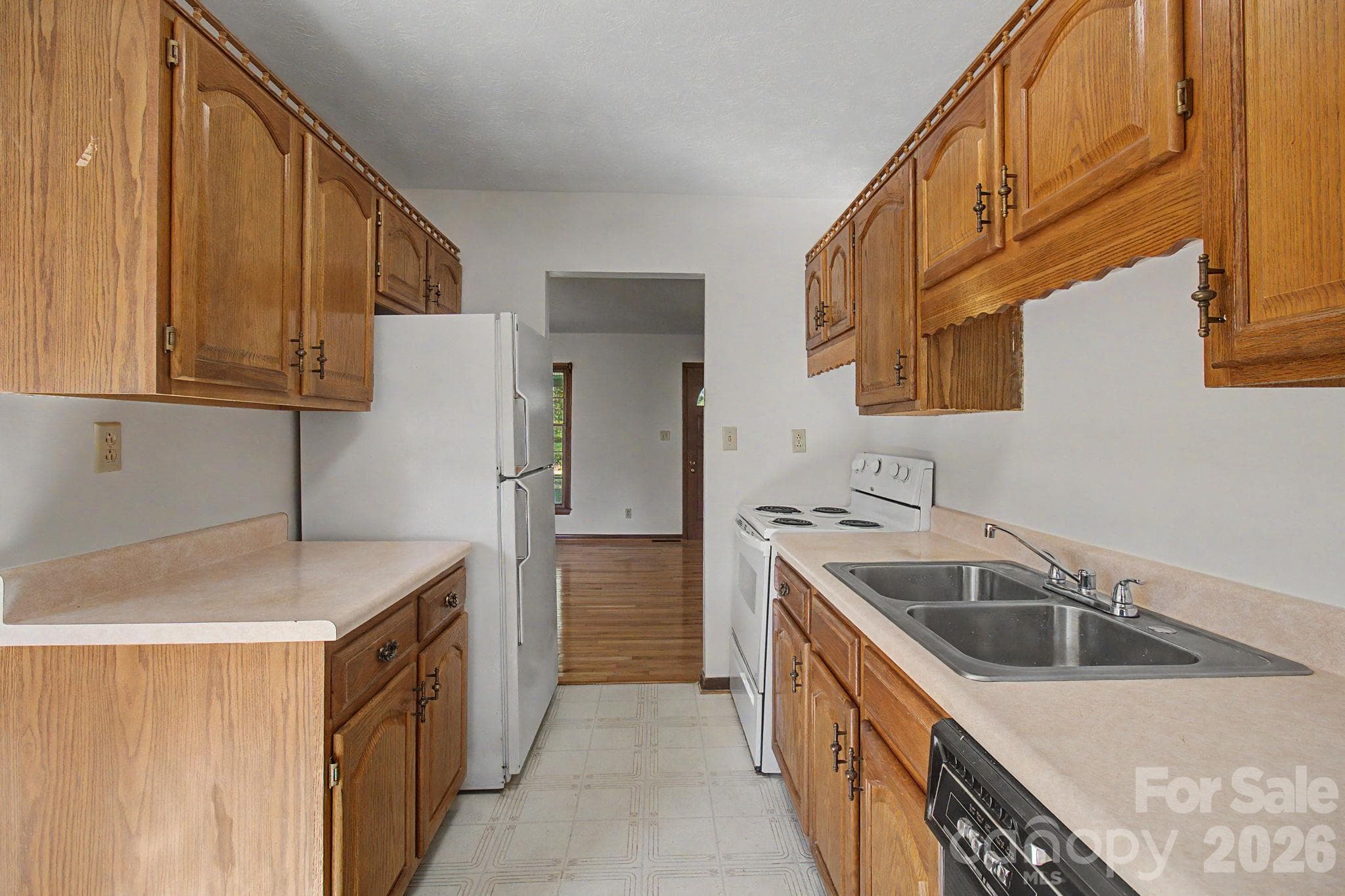 Kitchen through to hall - 188 Pinner Road, Arden