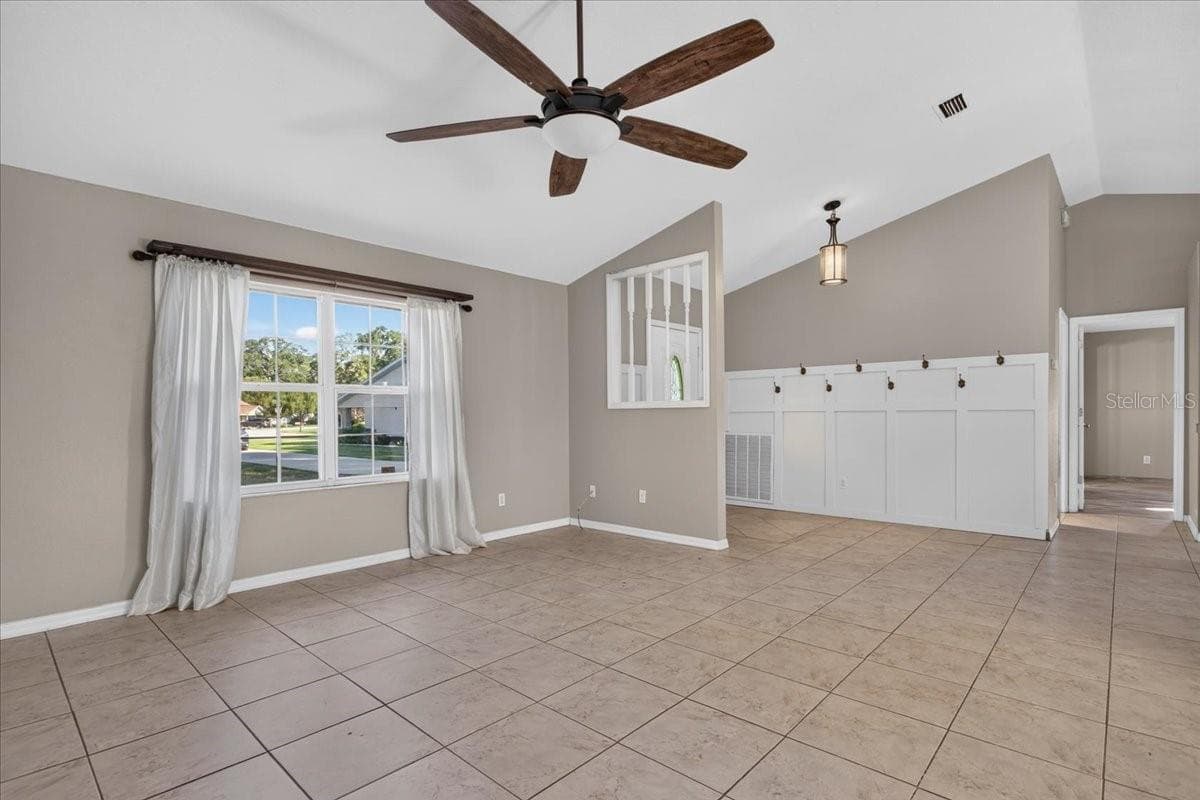 Family room toward front door - 10687 SW 74TH TER, OCALA