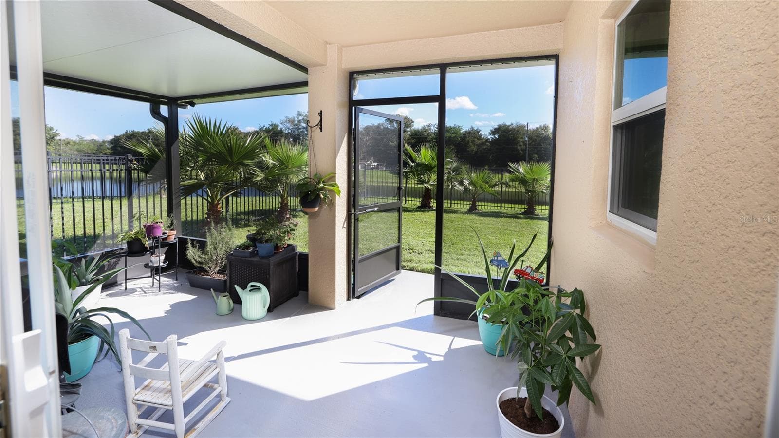 View from your Backporch! This WATERFRONT Retreat is so Private, You Will not be able to See ANY Neighbors from Your SCREENED Back Porch…You will only see Thousands of Dollars in Gorgeous Palm Trees, and beyond that just Water Views and Wildlife! - 15637 CARINA DR, ORLANDO