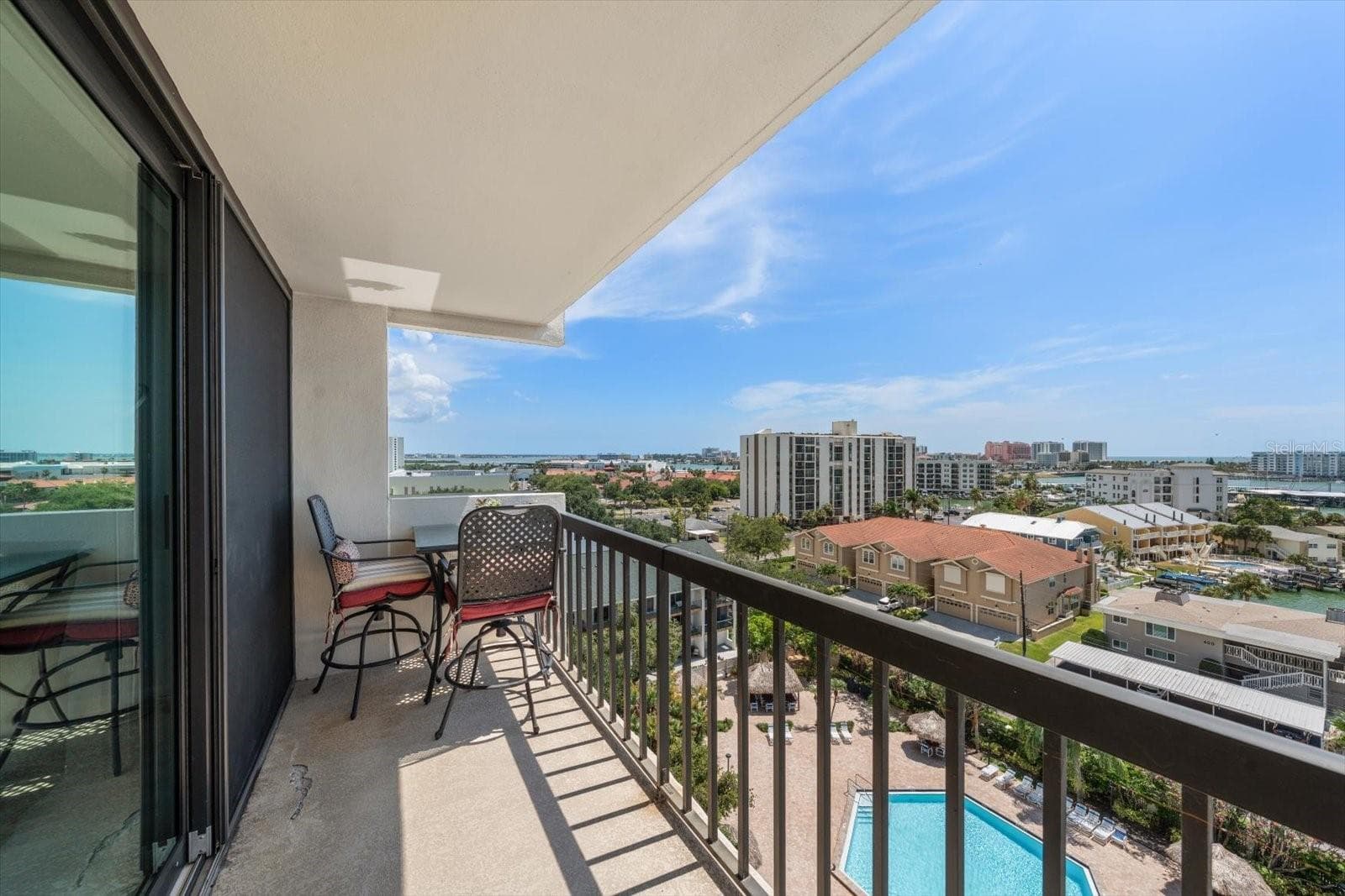 Soak in the scenery from your balcony overlooking the resort style pool! - 400 ISLAND WAY #904, CLEARWATER BEACH