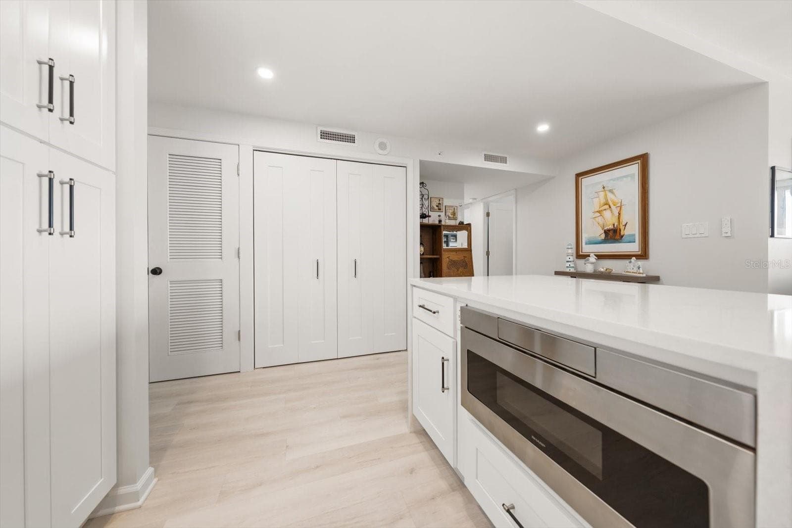 Built in microwave in kitchen island to efficiently free up cabinet & counter space. - 400 ISLAND WAY #904, CLEARWATER BEACH
