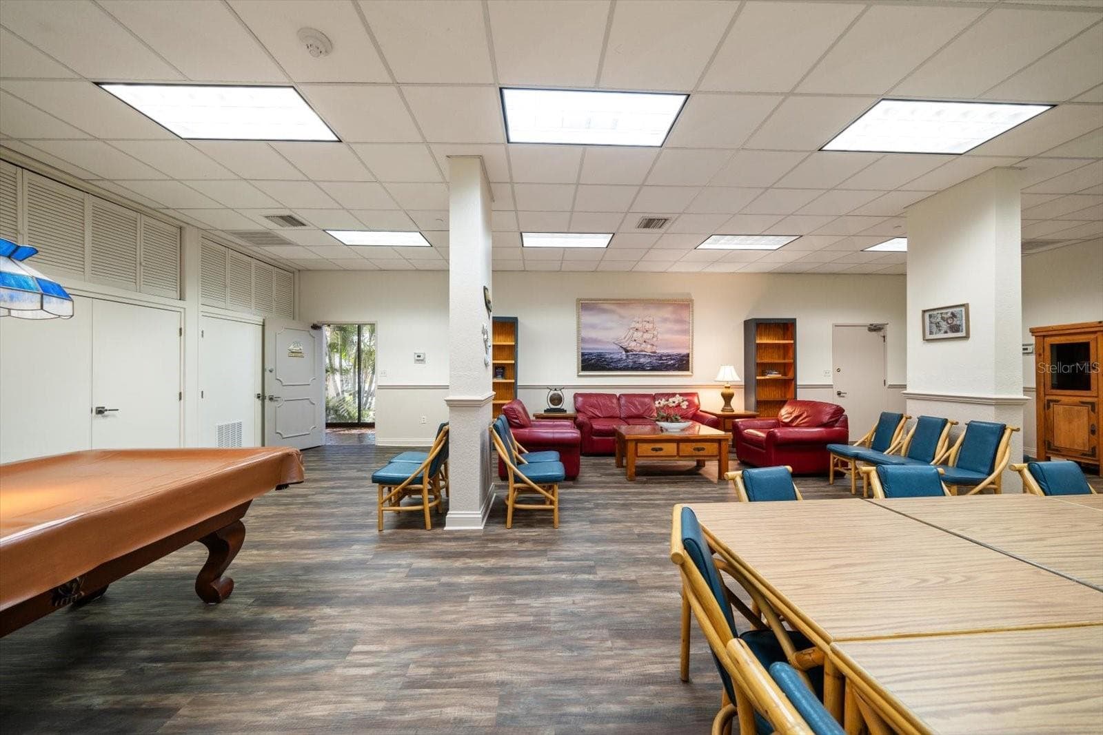 Community room featuring a kitchen, gathering space & billards. - 400 ISLAND WAY #904, CLEARWATER BEACH