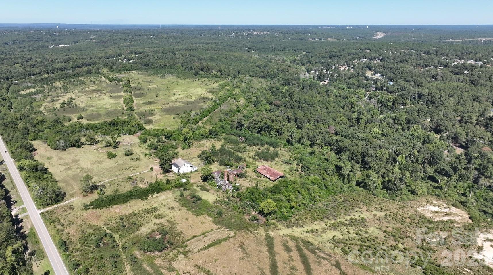 Open former farmland and tree lines across the PUD A parcel. - 1001 Old Aiken Road, North Augusta
