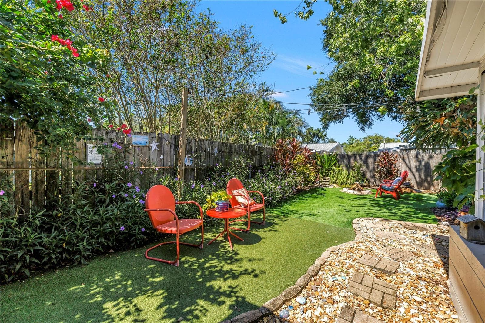 Charming garden pathway leading into the backyard. - 2573 62ND TER N, ST PETERSBURG