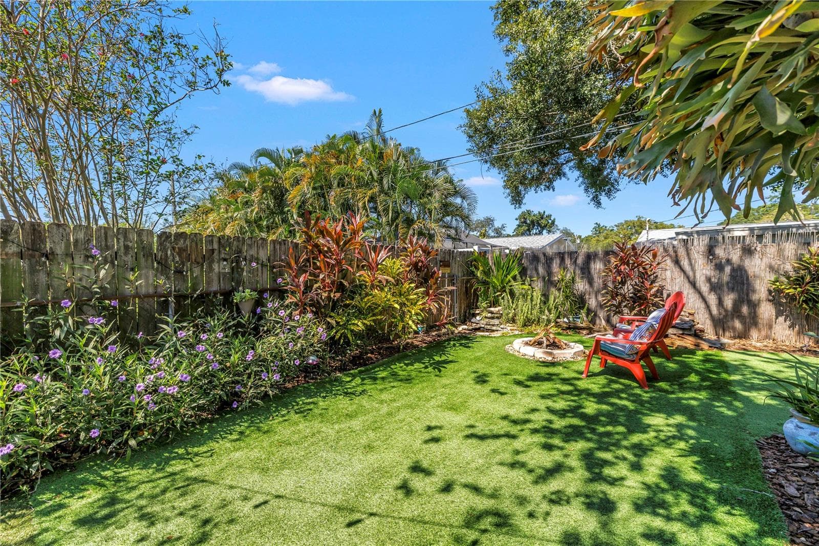 Fire pit and koi pod in the corner provide captivating ambiance. - 2573 62ND TER N, ST PETERSBURG