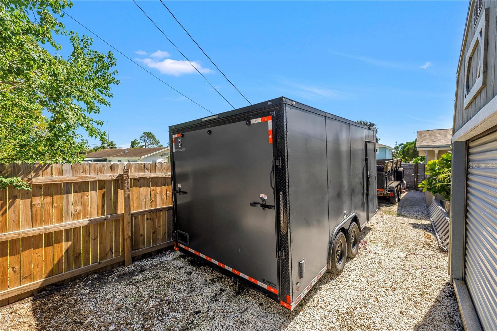 The current owner has two of his trailers parked here and plenty of room left over. You could fit all sorts of big toys back here, protected by a locked access gate up front. - 2573 62ND TER N, ST PETERSBURG