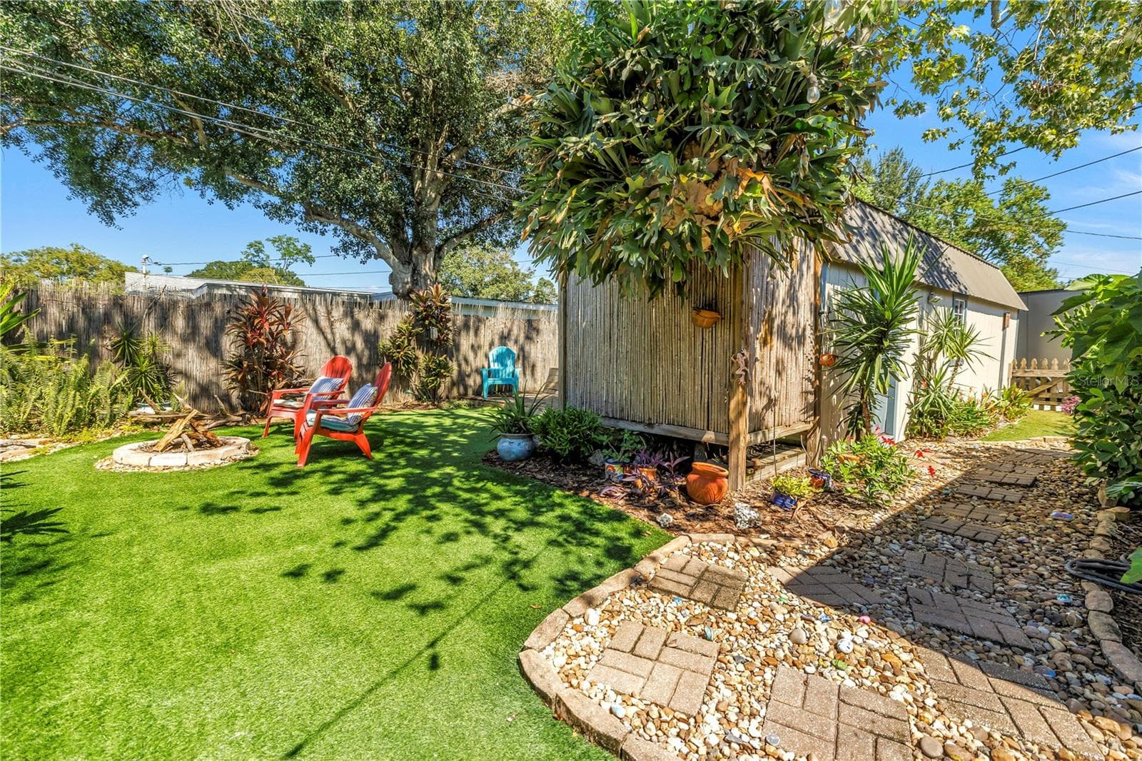 Notice the bamboo enclosure. That's where the outdoor heated shower area, concealed with the bamboo for your privacy. - 2573 62ND TER N, ST PETERSBURG