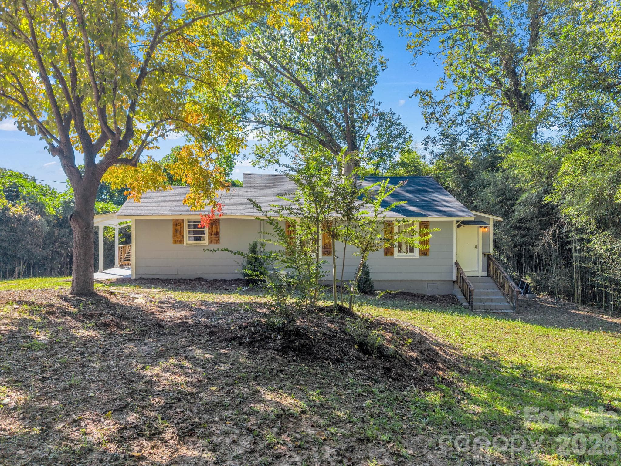 Right side view, stairs lead to the laundry room - 51 Shepherd Street, Tryon