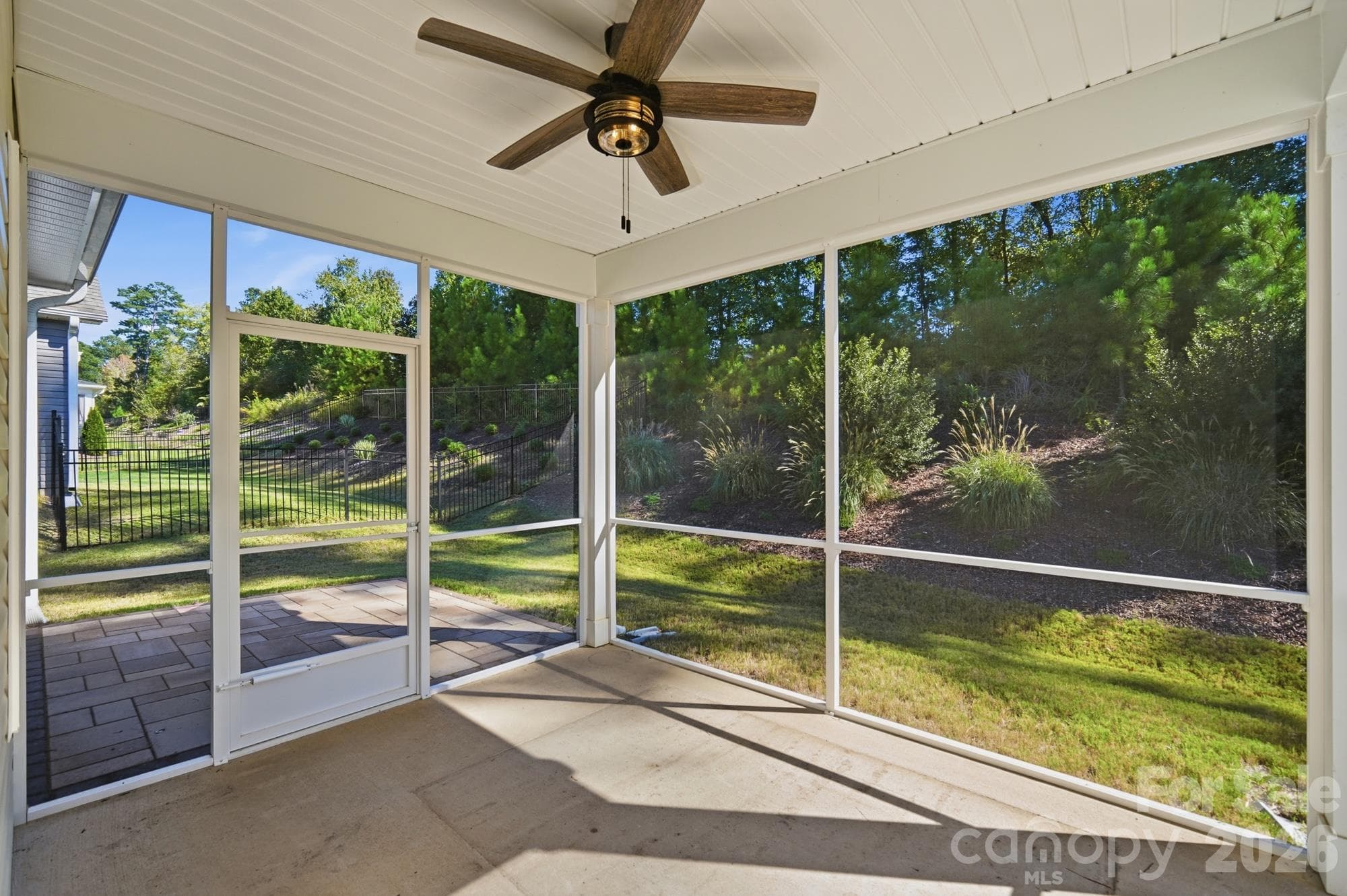 Large covered and screened in back porch facing your tree lined back yard - 7656 Tanglewood Way, Denver