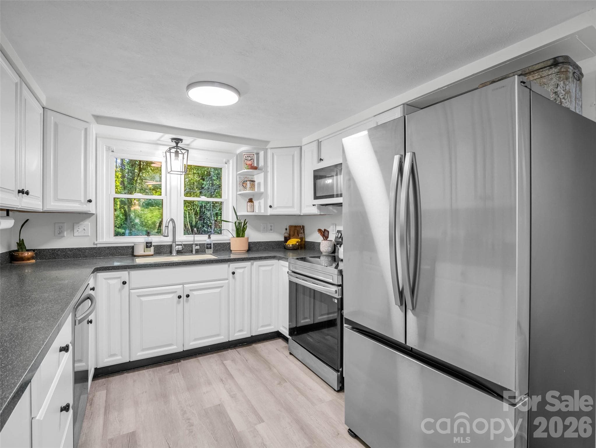 A welcoming kitchen with everything close at hand. - 913 Dorothy Street, Hendersonville