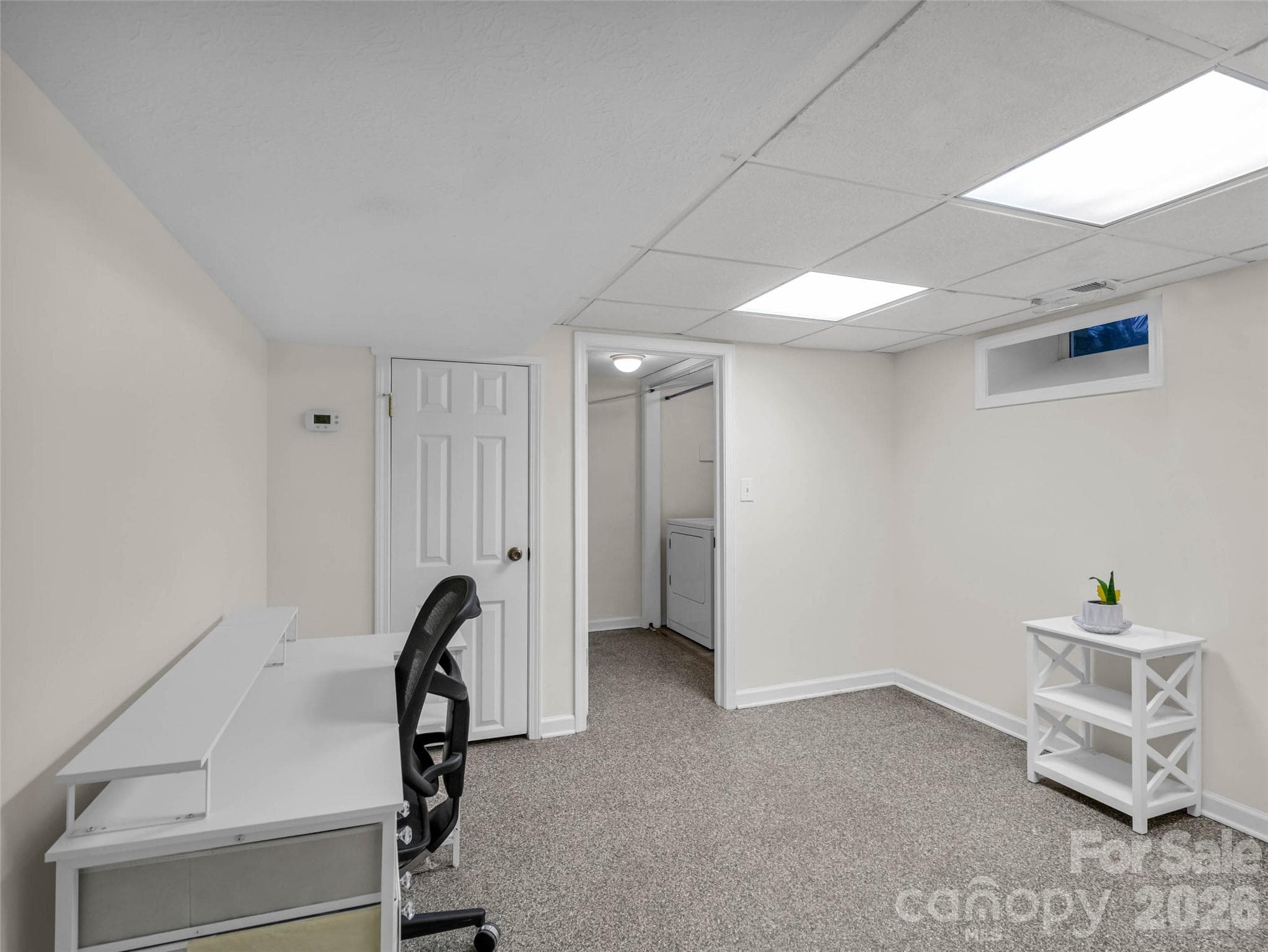 A versatile finished room ideal for work, hobbies, or other needs. - 913 Dorothy Street, Hendersonville