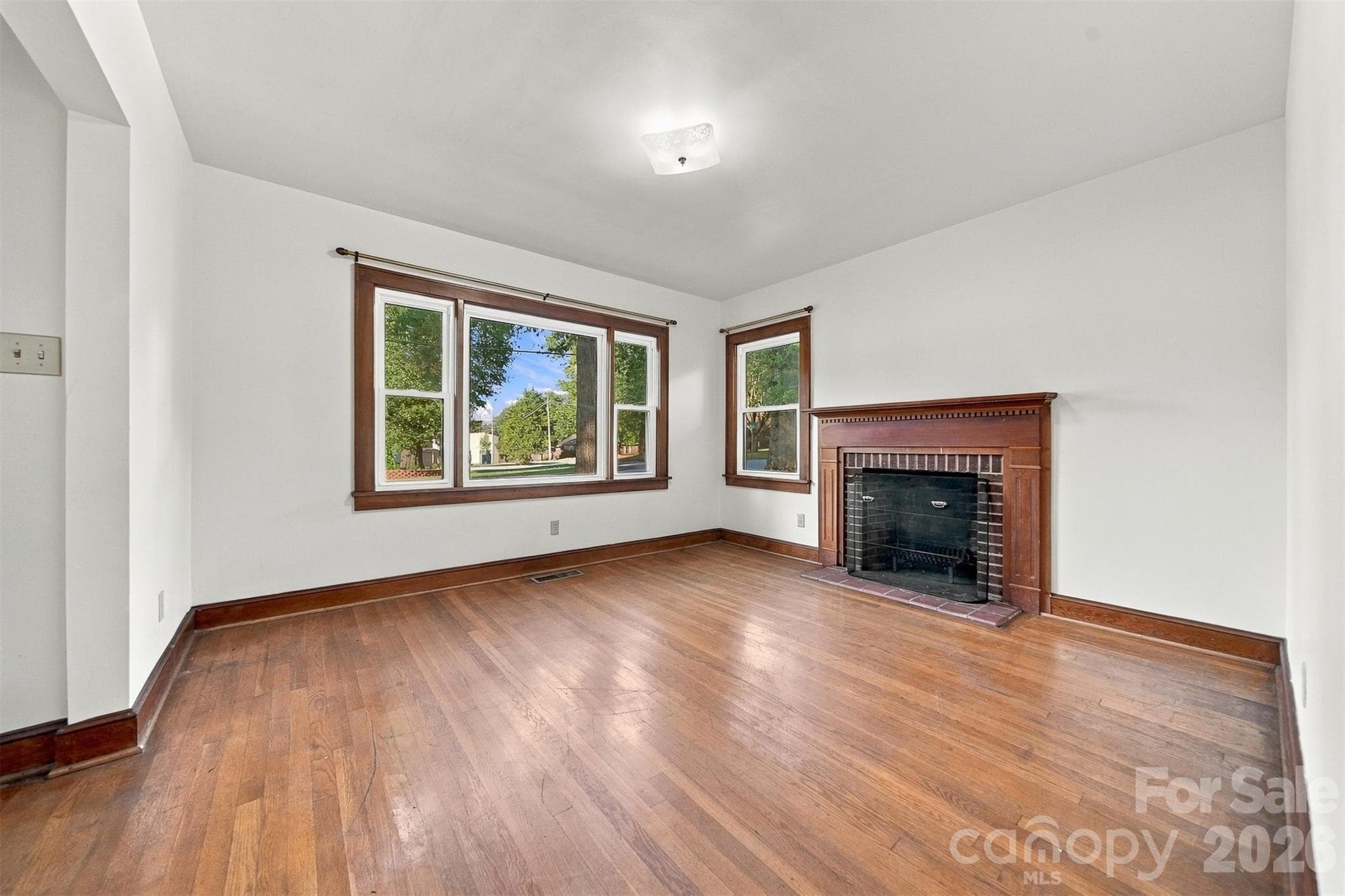 Wood burning fireplace has not been used in many years. You could add Natural gas logs! - 203 W 21st Street, Newton