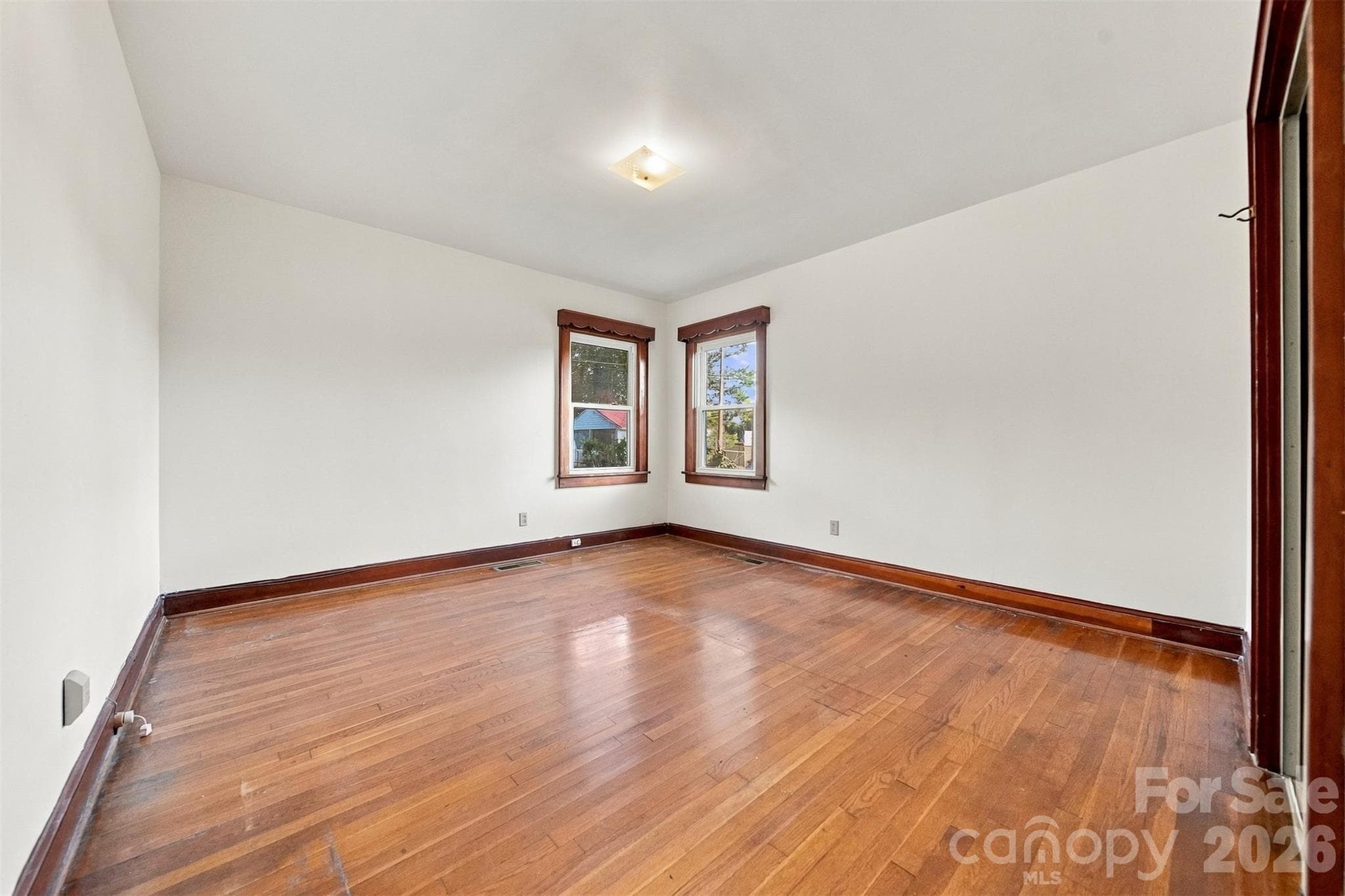 Bedroom with corner windows and nice sized closet. Hardwood floors. - 203 W 21st Street, Newton