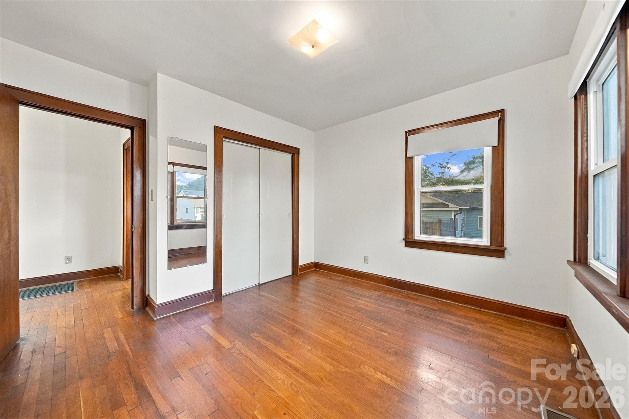 Bedroom #2 at back of the home. Lots of natural light, hardwood floors and big closet. - 203 W 21st Street, Newton