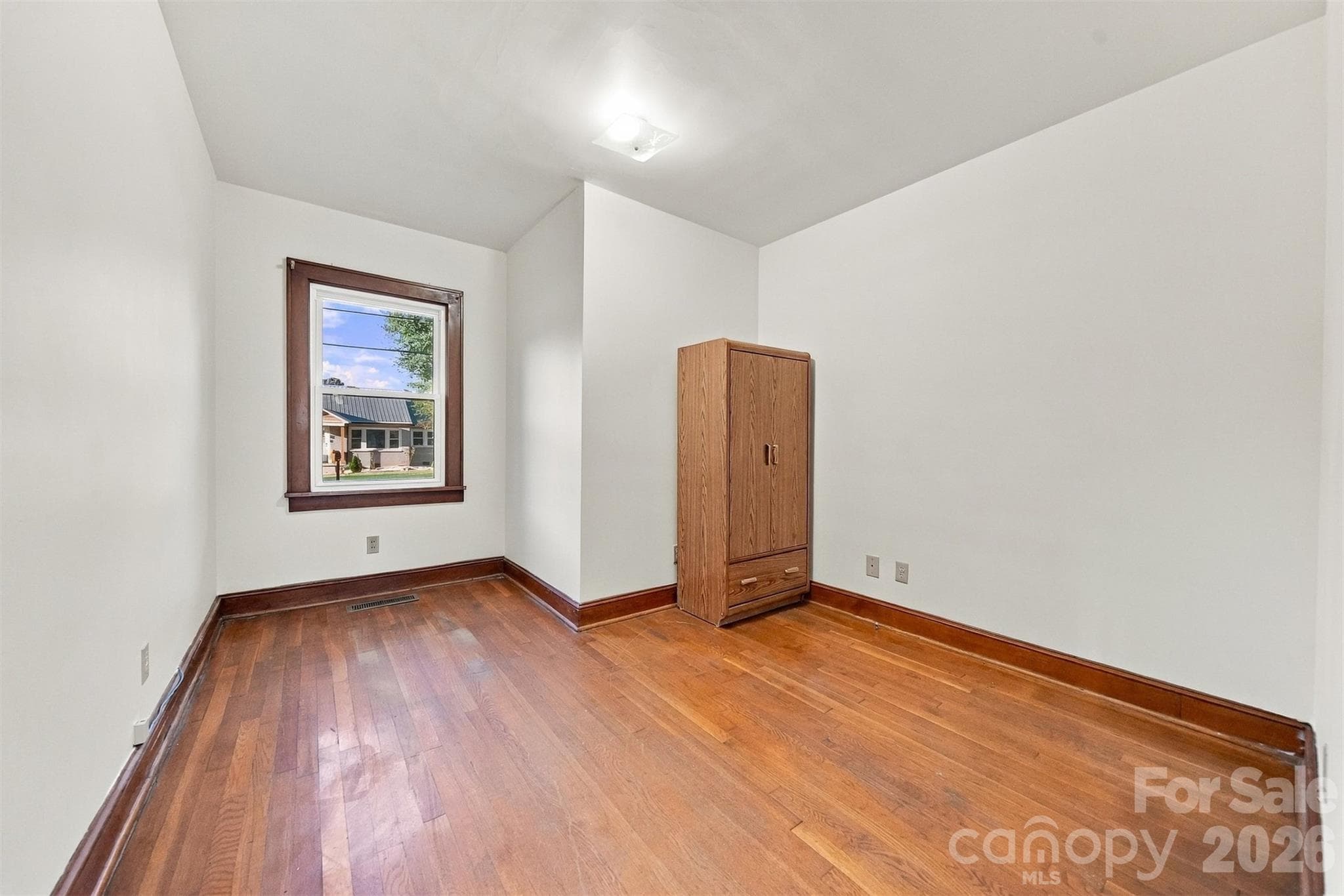 Bedroom #3 was used as an office by current owner. Wardrobe remains since there is not a closet. - 203 W 21st Street, Newton