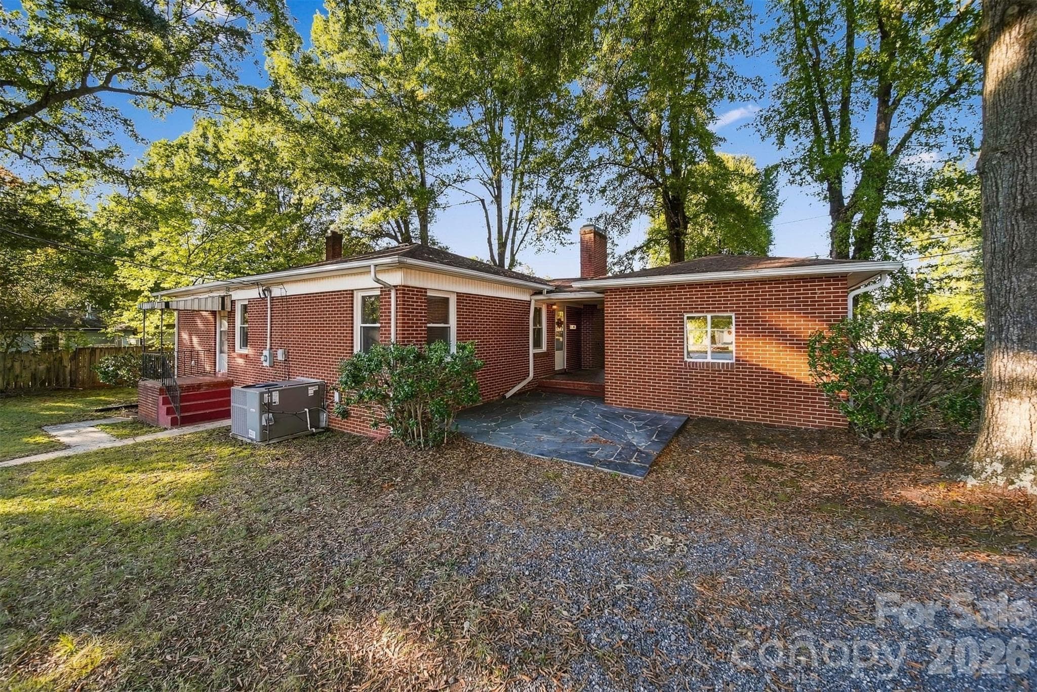 Back of home features a really nice flagstone patio perfect for cook outs! - 203 W 21st Street, Newton