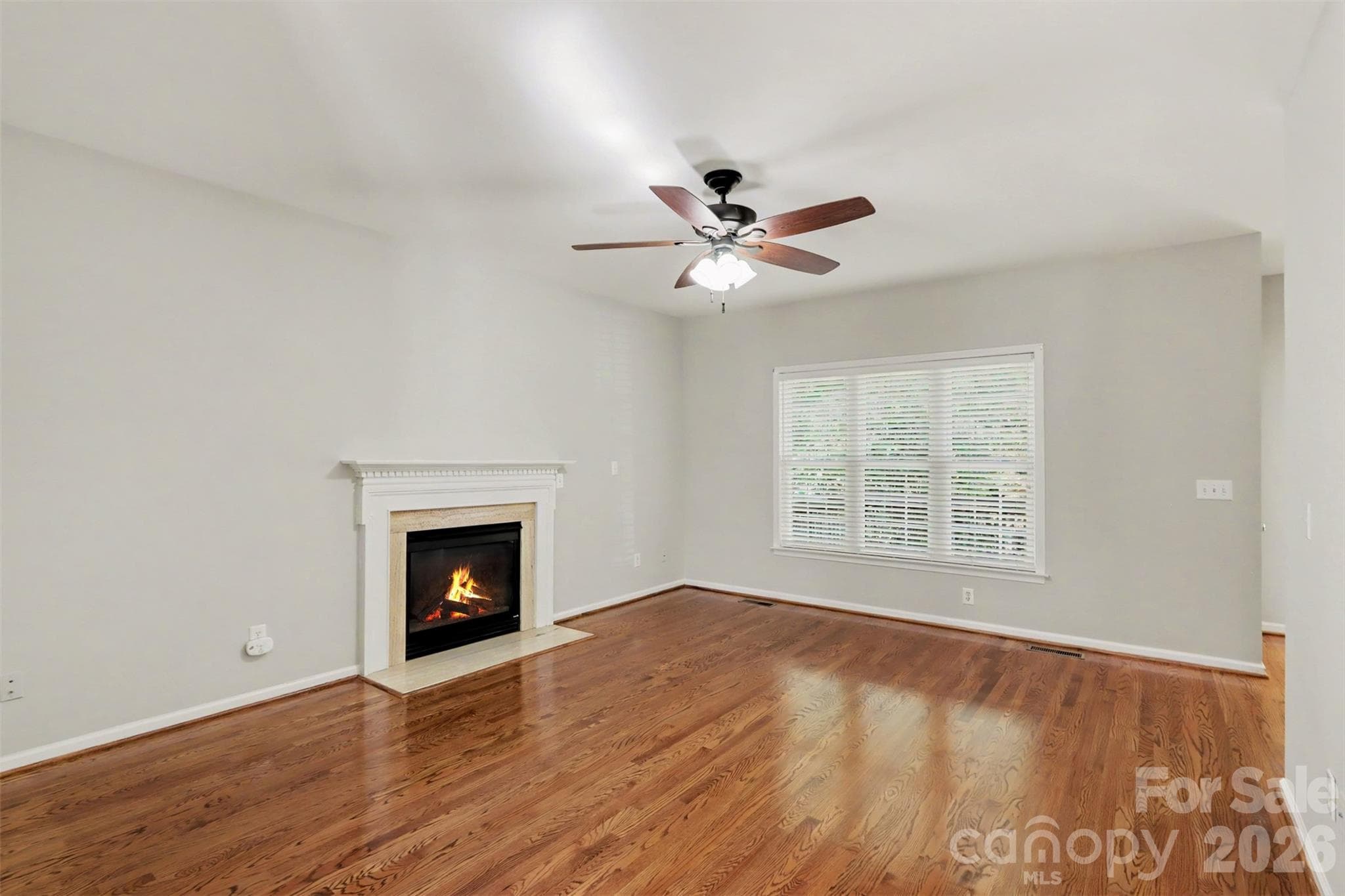 Family Room with fireplace, hardwoods & ceiling fan - 17028 Hampton Trace Road, Huntersville