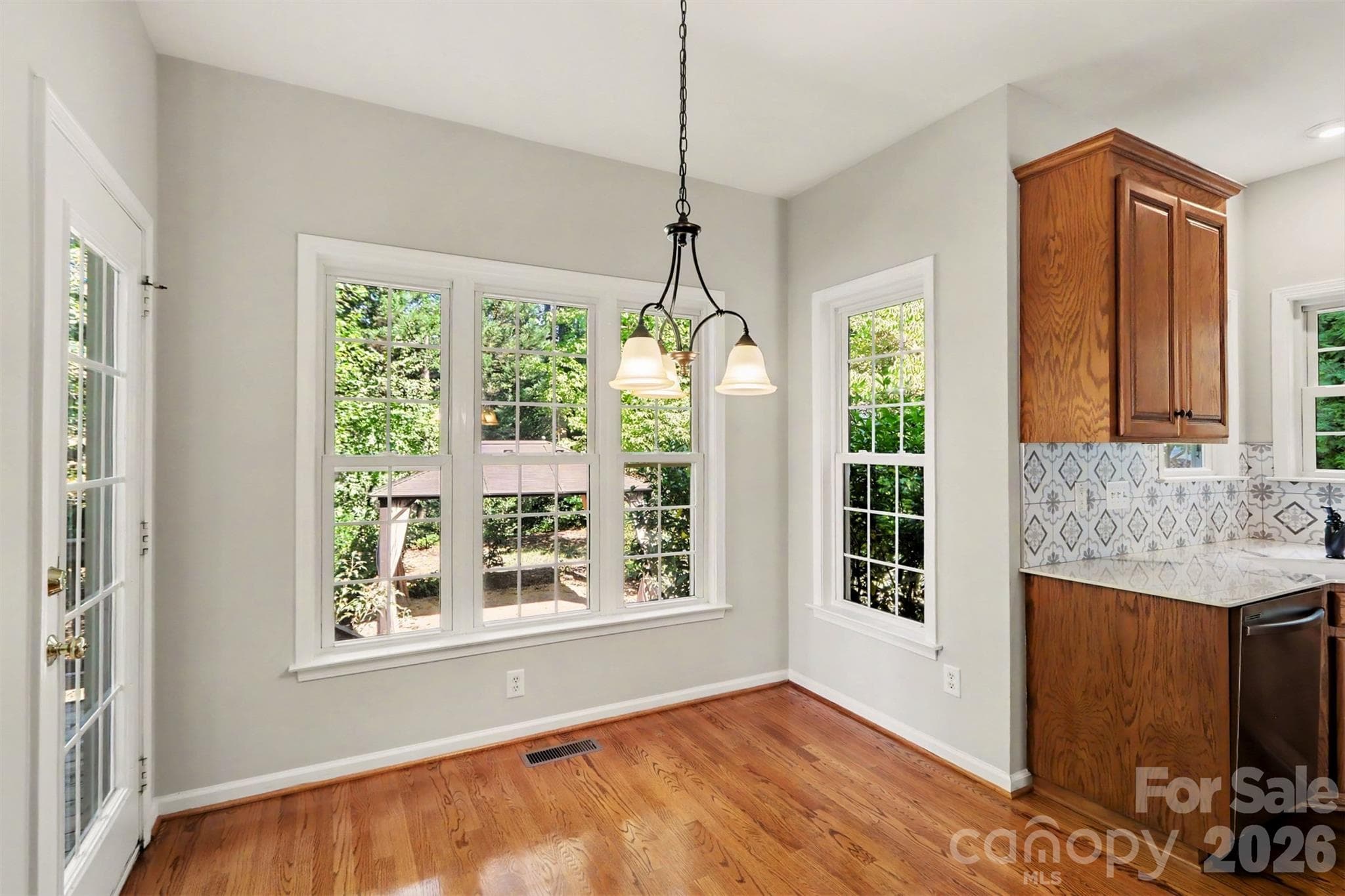 Breakfast area overlooking backyard - 17028 Hampton Trace Road, Huntersville