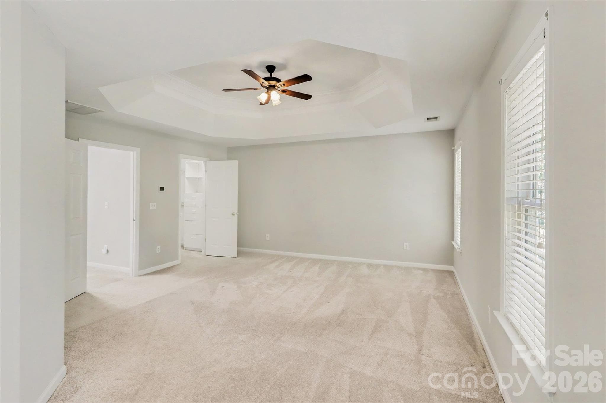 Primary Bedroom, Tray Ceiling with Fan, lots of space for your furniture - 17028 Hampton Trace Road, Huntersville