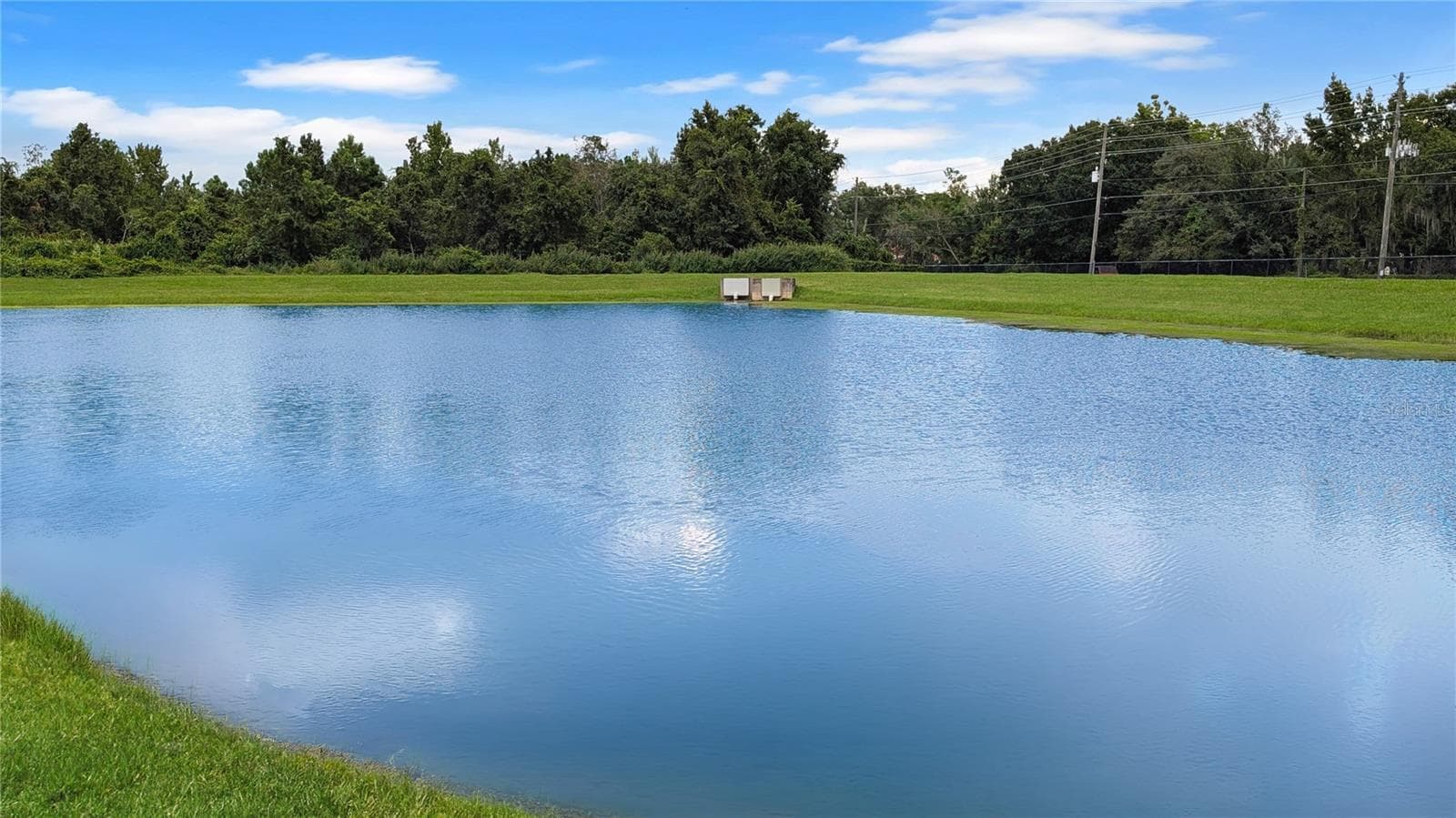 This WATERFRONT Retreat is so Private, You Will not be able to See ANY Neighbors from Your SCREENED Back Porch…You will only see Thousands of Dollars in Gorgeous Palm Trees, and beyond that just Water Views and Wildlife! - 15637 CARINA DR, ORLANDO