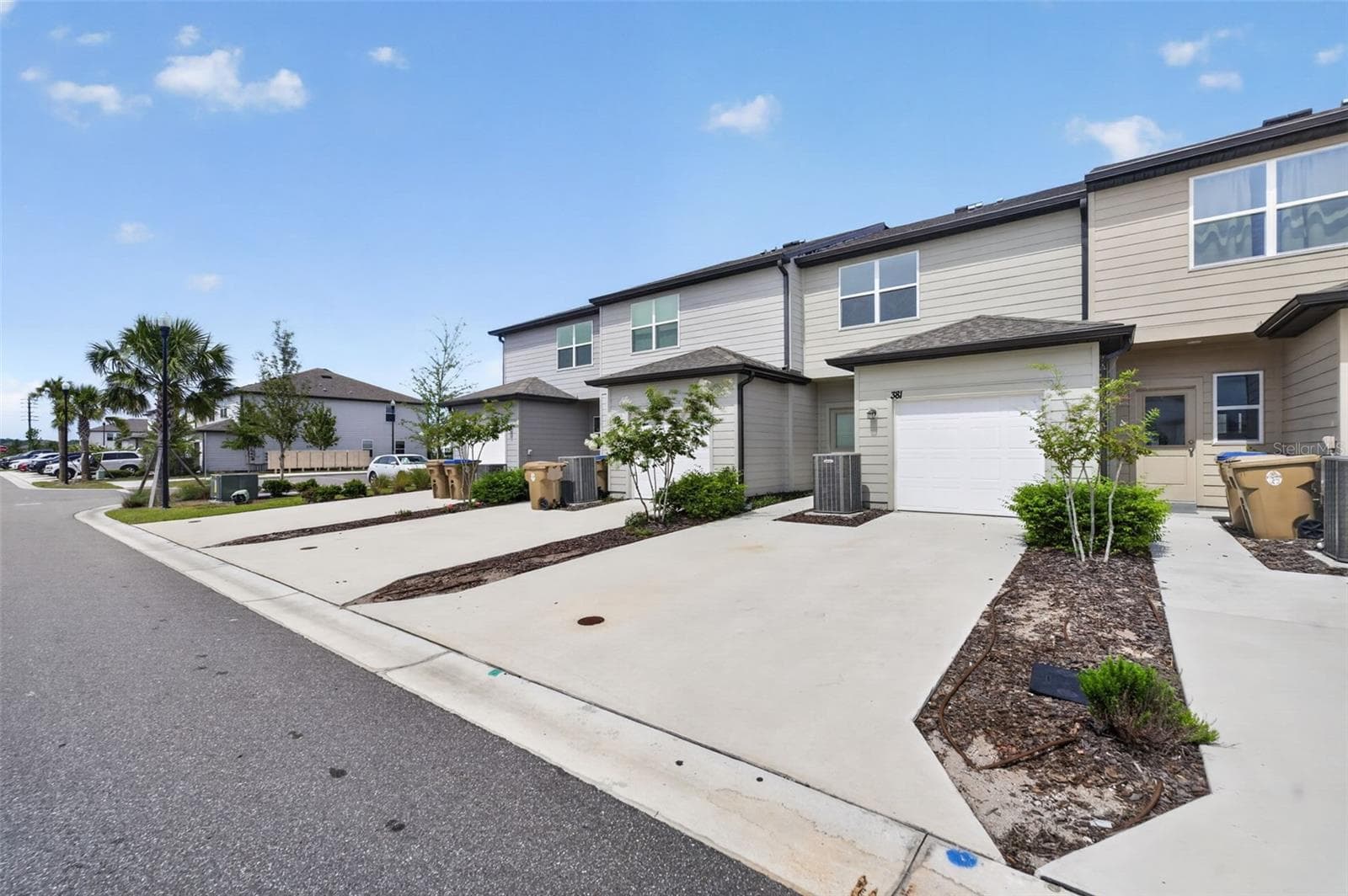 Rear view of townhome - 381 GRAND PINE LN, ST CLOUD