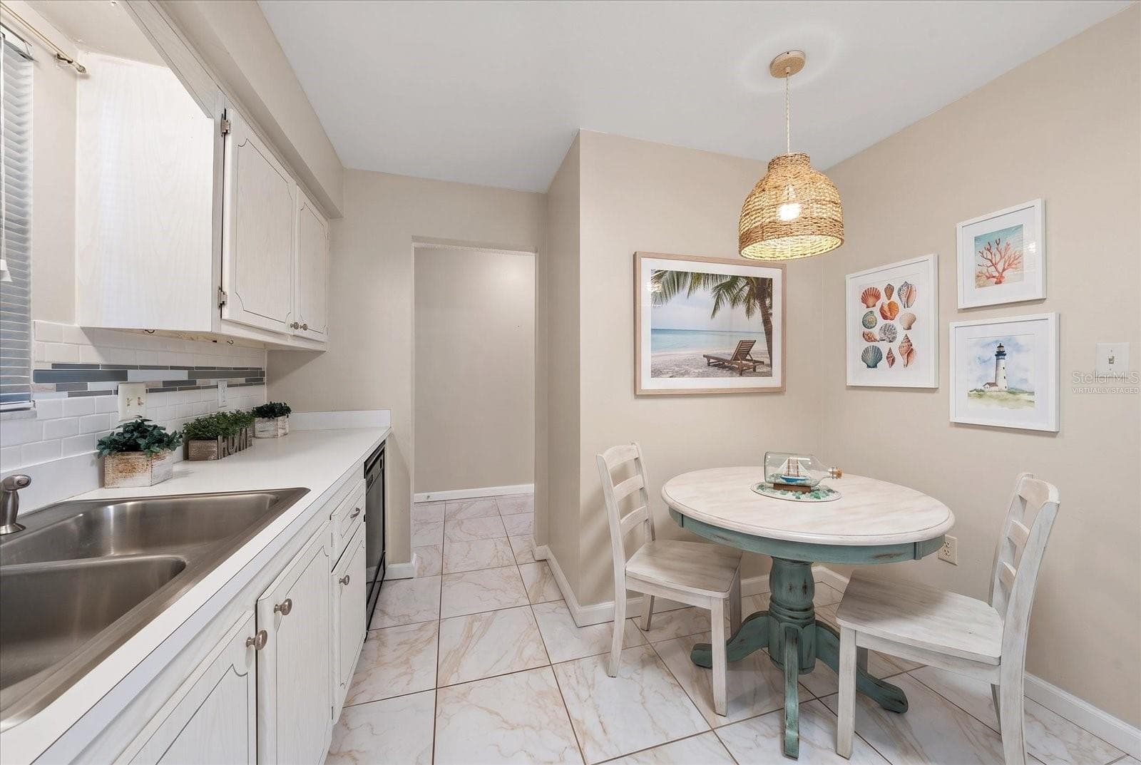Kitchen with dining space virtually staged - 1706 BELLEAIR FOREST DR #238, BELLEAIR