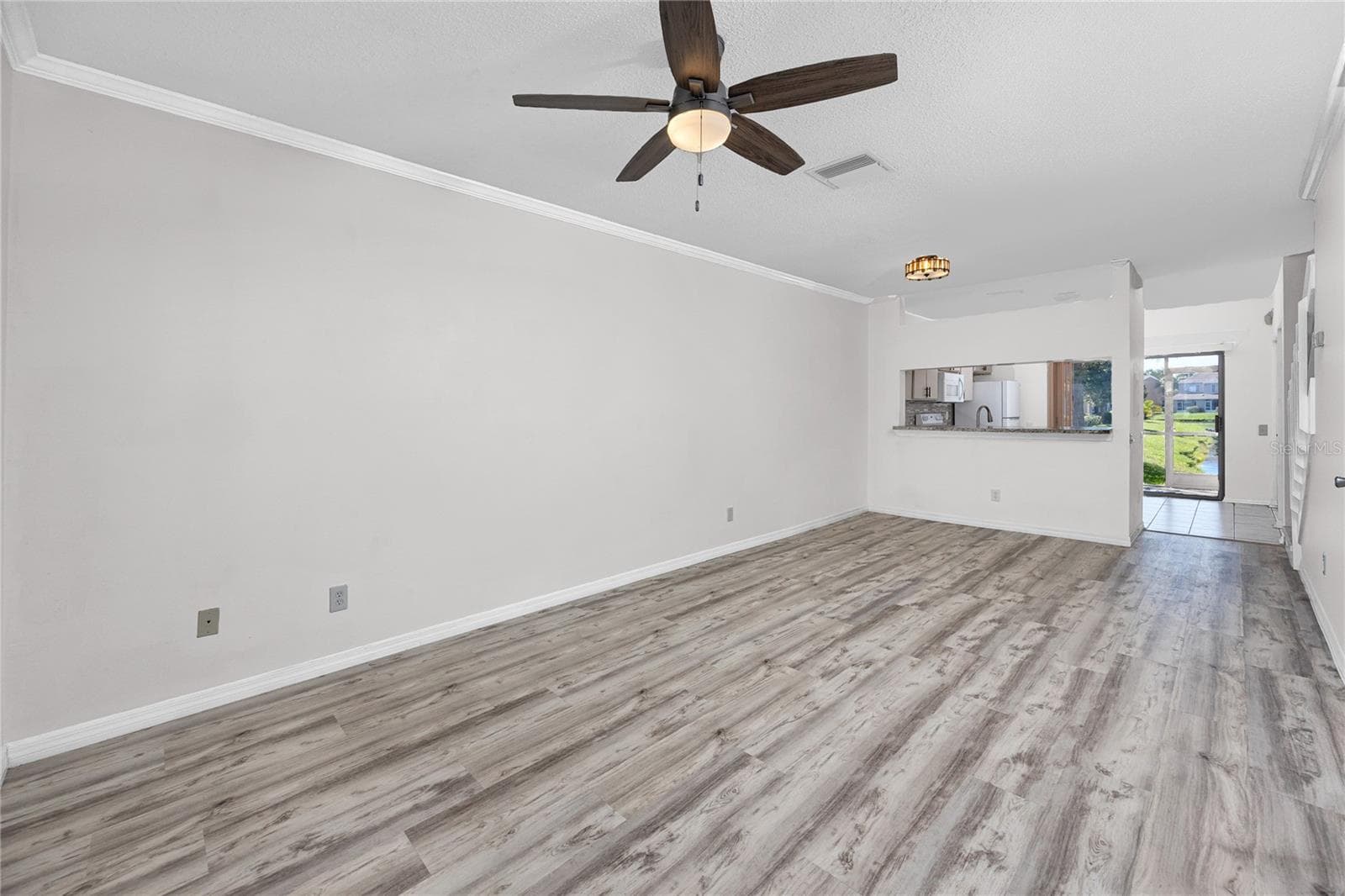 Open concept living area with Luxury Vinyl Plank -6229 Bayside Key Dr, Tampa, FL 33615 - 6229 BAYSIDE KEY DR, TAMPA