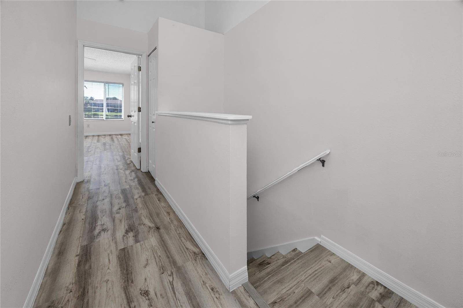 Upstairs Hallway with LVP -6229 Bayside Key Dr, Tampa, FL 33615 - 6229 BAYSIDE KEY DR, TAMPA