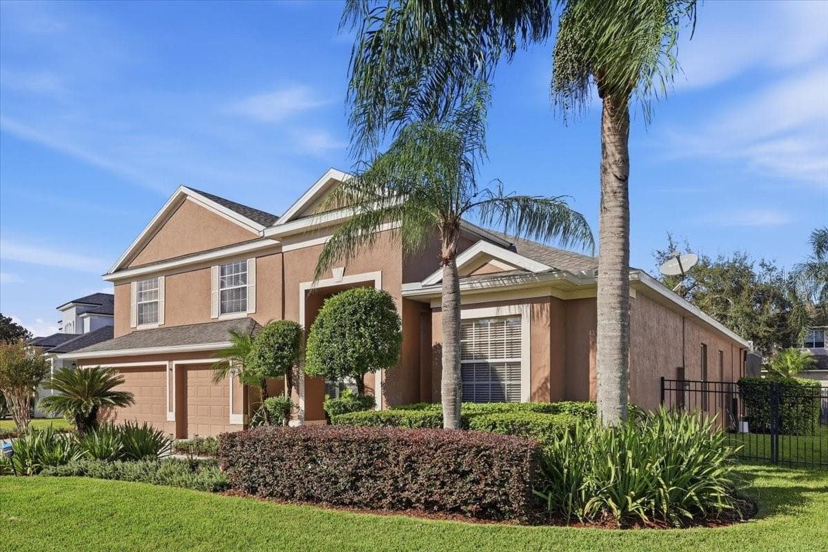 Manicured landscaping adds to the curb appeal. - 2631 TREYMORE DR, ORLANDO