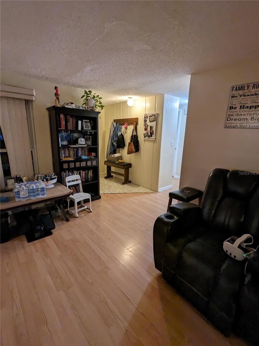 LIVING ROOM FOREGROUND AND FOYER IN BACKGROUND - 3937 SAIL DR, NEW PORT RICHEY