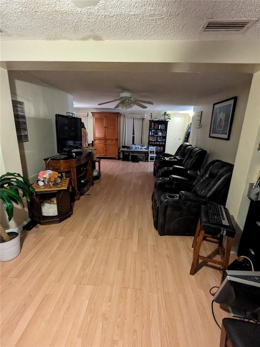 VIEW FROM LIVING ROOM EXTENSION THRU TO FRONT WINDOWS OF HOME - 3937 SAIL DR, NEW PORT RICHEY