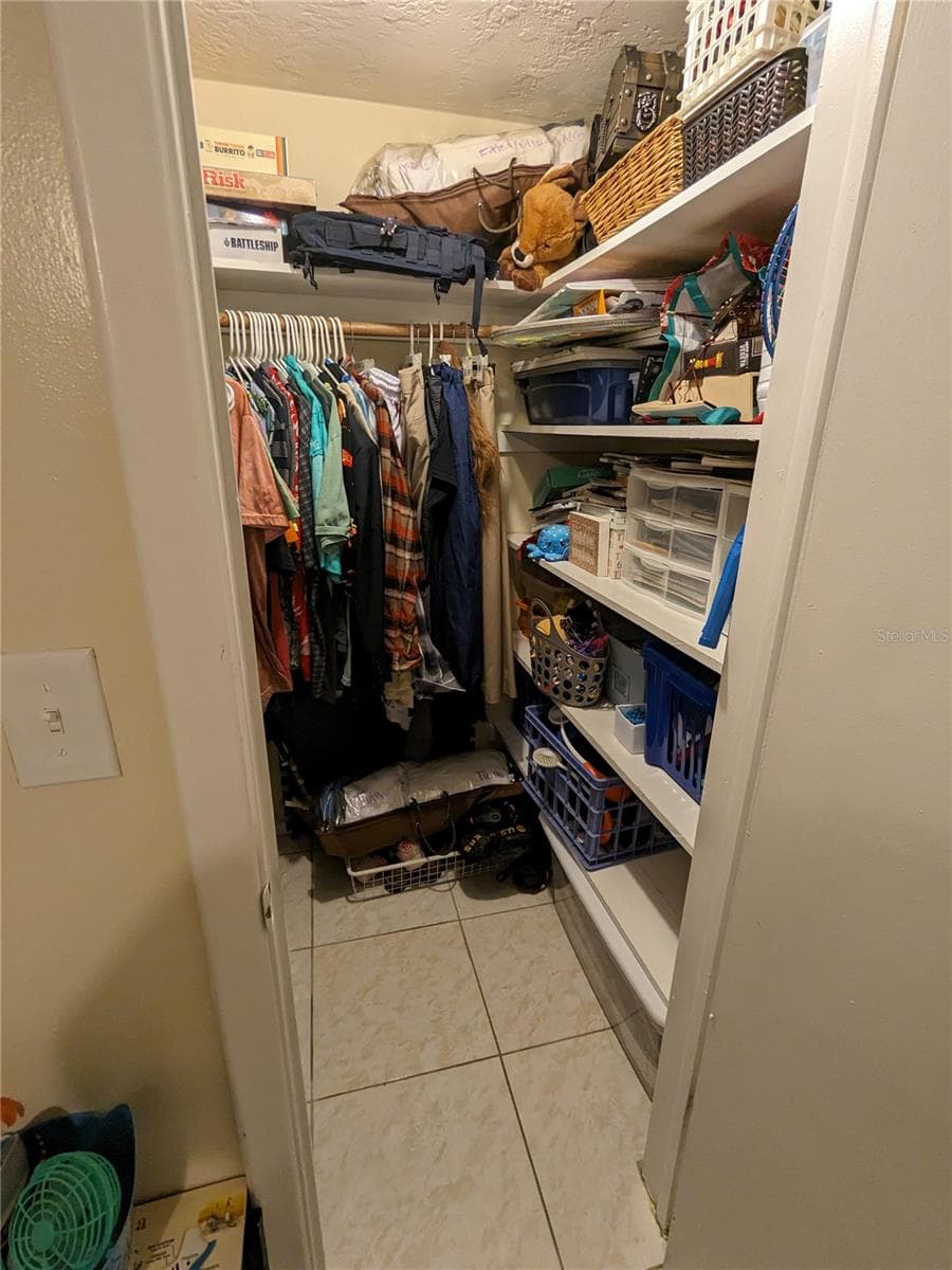 WALK-IN CLOSET IN GUEST BEDROOM - 3937 SAIL DR, NEW PORT RICHEY