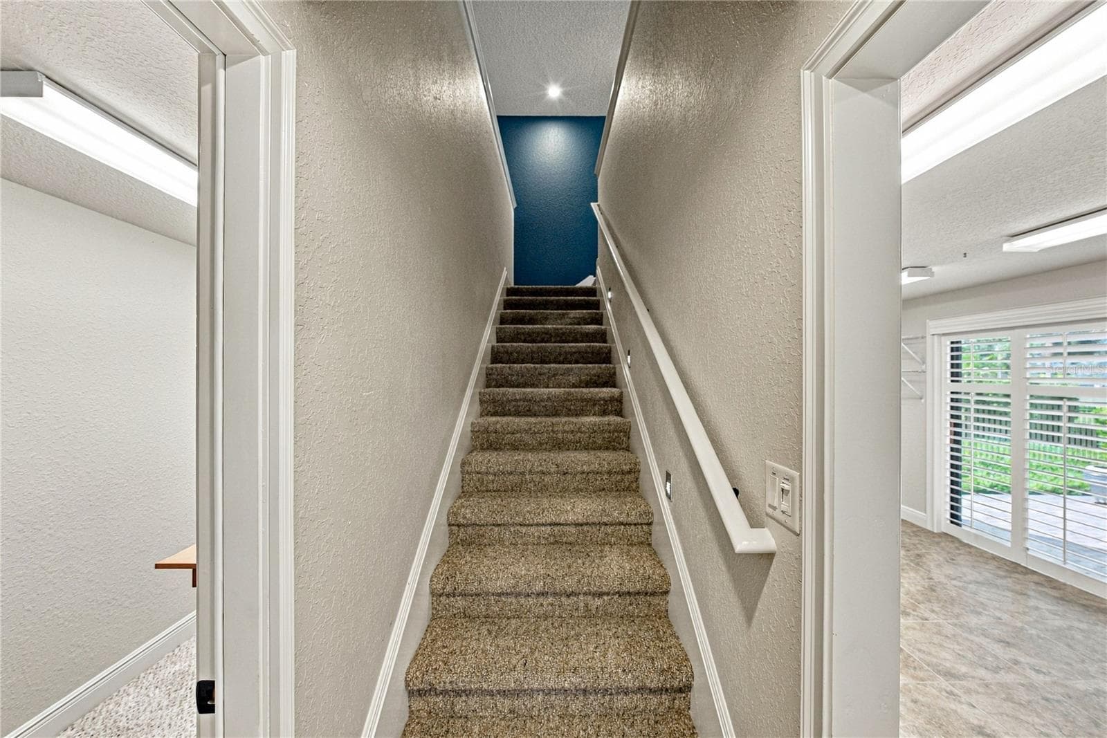 Stairs to bonus room and spacious attic for easy storage - 520 HOMECOMING WAY, POLK CITY
