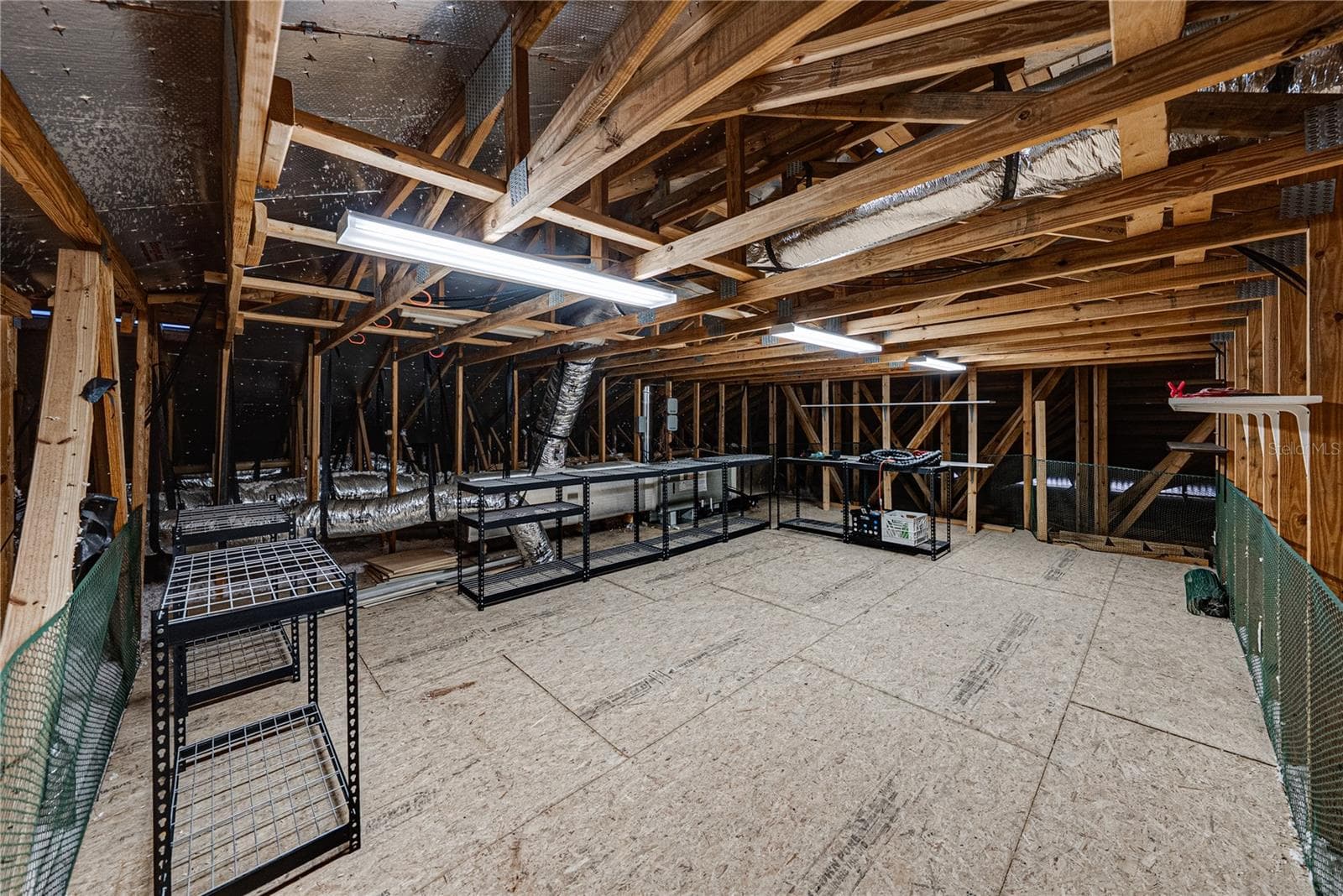 Extra attic access from bonus room with ample storage and attic fan - 520 HOMECOMING WAY, POLK CITY