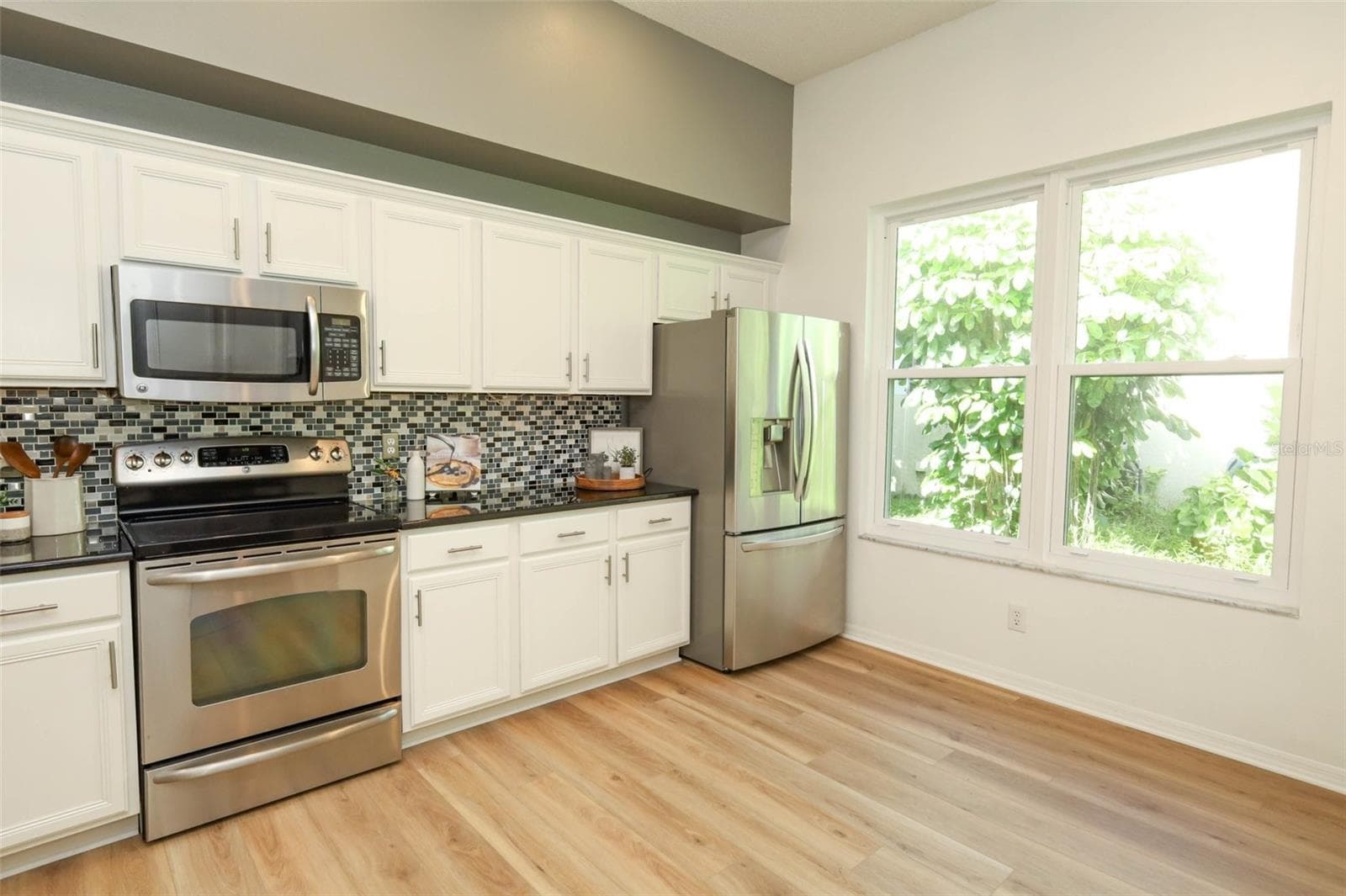 Kitchen with Stainless Steel Appliances & Large Window - 3581 FOXCROFT CIR, OVIEDO