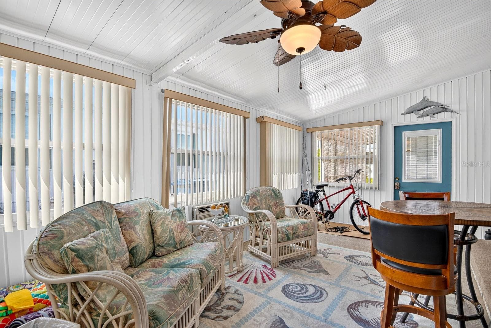 Enclosed living area facing front of home - 2107 PALMA SOLA BLVD #12, BRADENTON