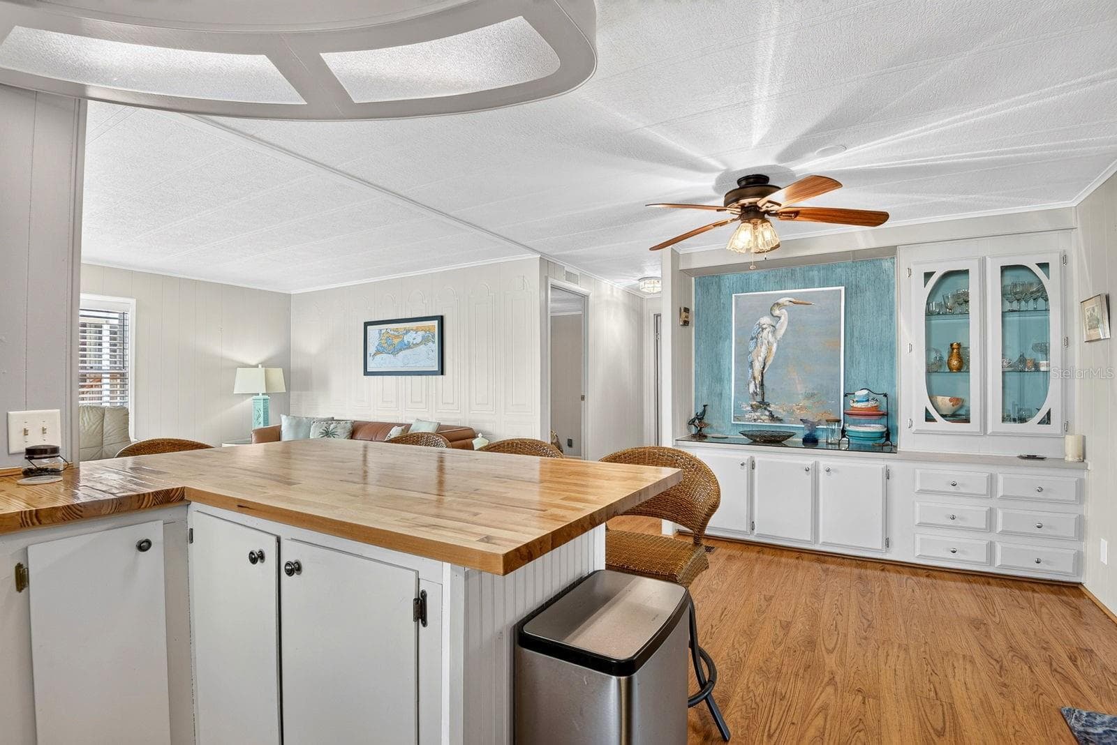 Kitchen facing dining area with built in cabinet - 2107 PALMA SOLA BLVD #12, BRADENTON