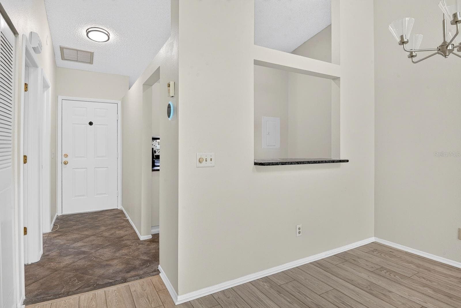 Dining area with Kitchen behind and entryway - 2930 64TH ST W #130, BRADENTON