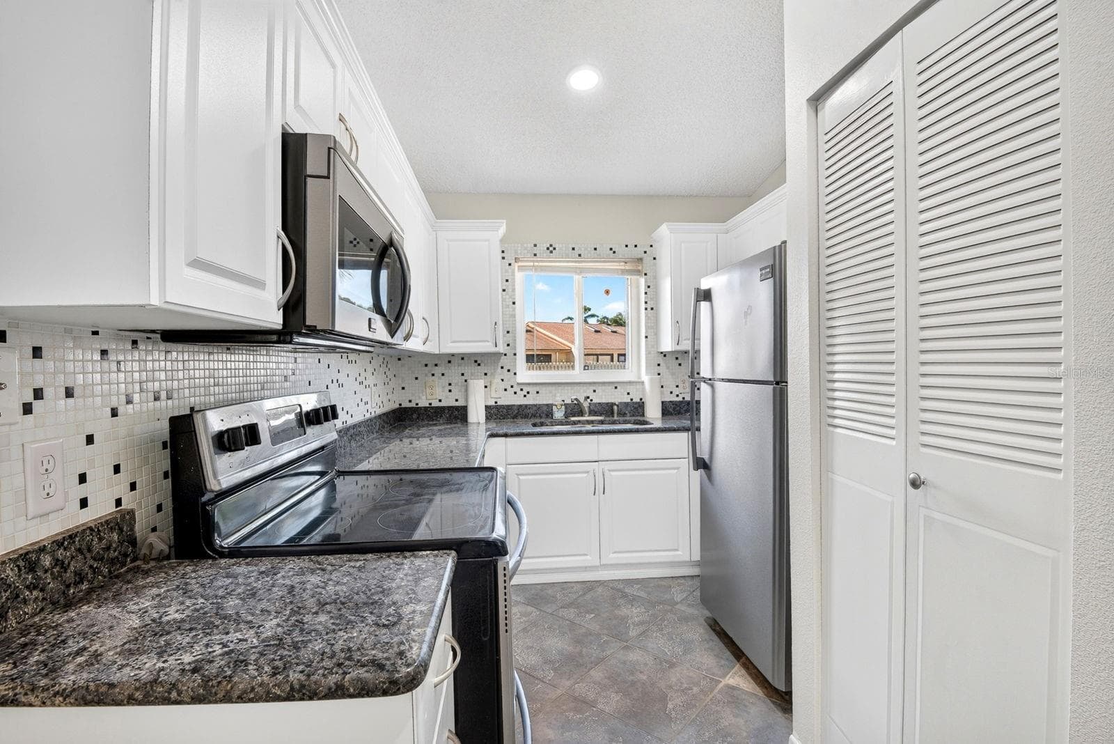 Kitchen facing in to the front - 2930 64TH ST W #130, BRADENTON