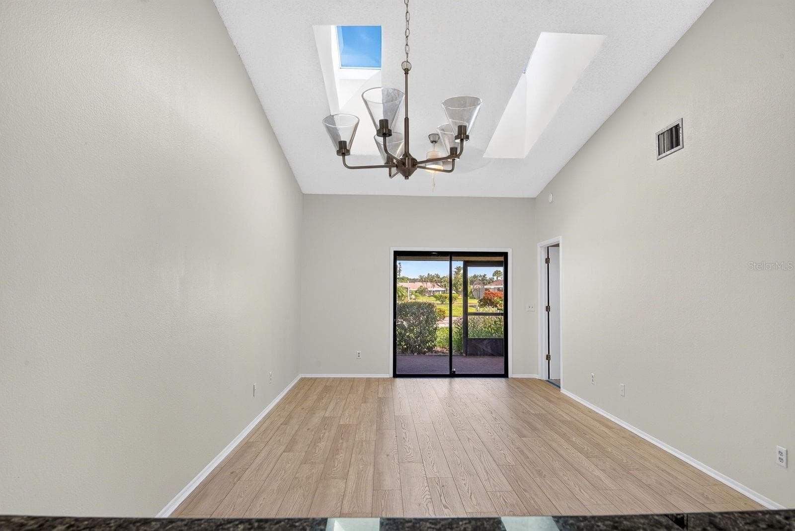 Living and Dining area wide open with skylights - 2930 64TH ST W #130, BRADENTON