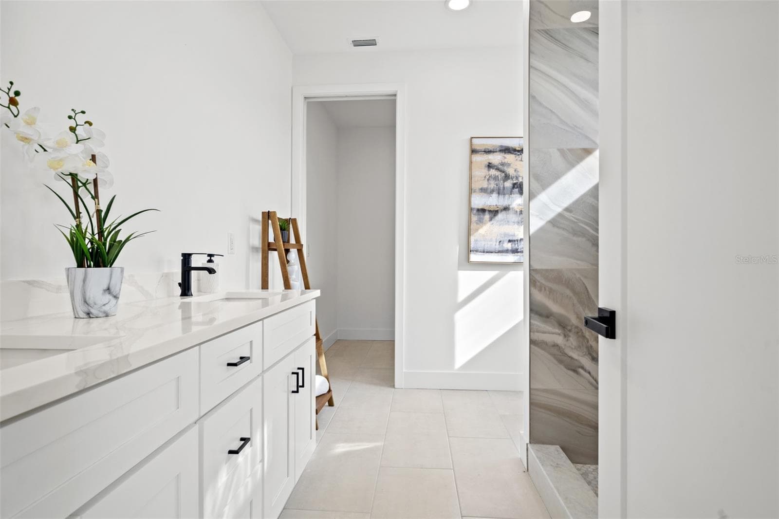 Bathroom vanity in a completed model residence - 6209 64TH WAY N, PINELLAS PARK