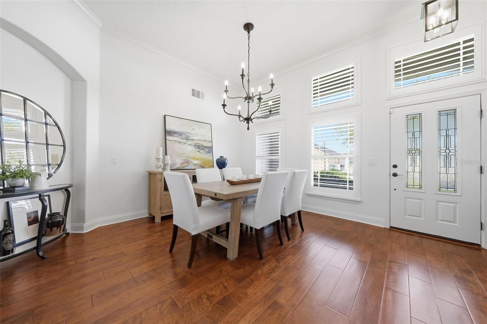 DINING ROOM WITH BEAUTIFUL POTTERY BARN CHANDELIER - 13850 BLUEWATER CIR, ORLANDO