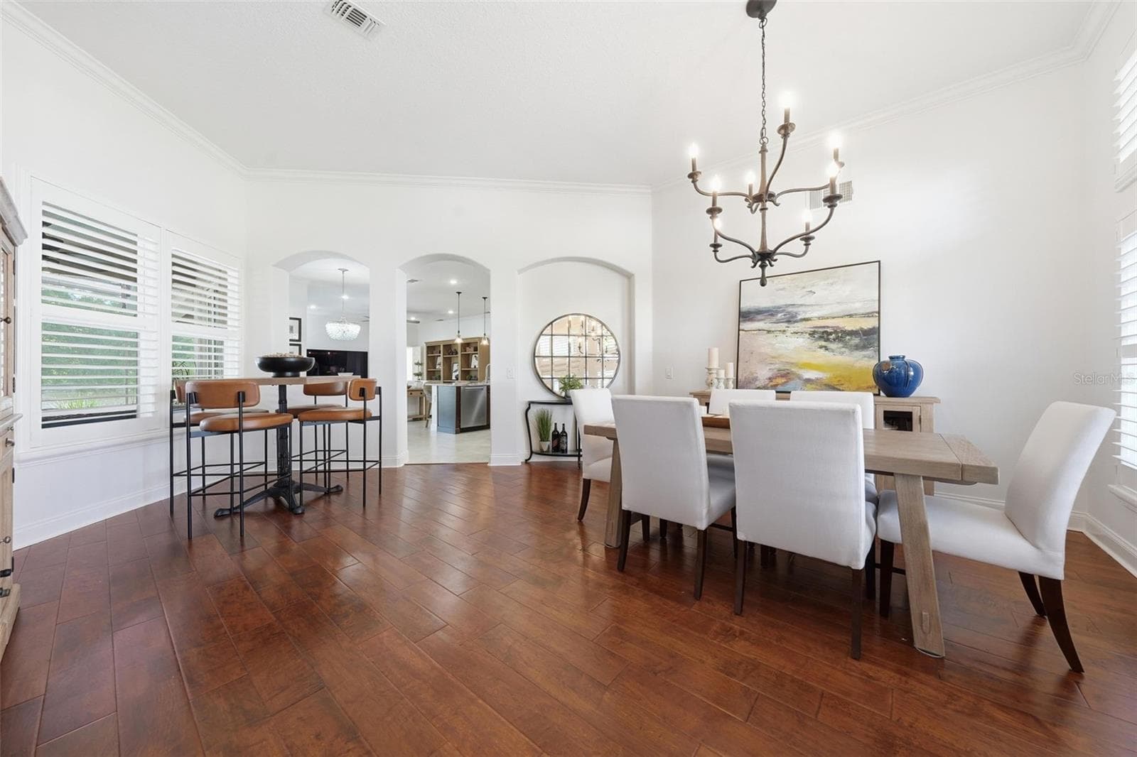 FRONT LIVING ROOM AND DINING ROOM. LEFT SIDE COULD BE USED AS A SITTING AREA. - 13850 BLUEWATER CIR, ORLANDO