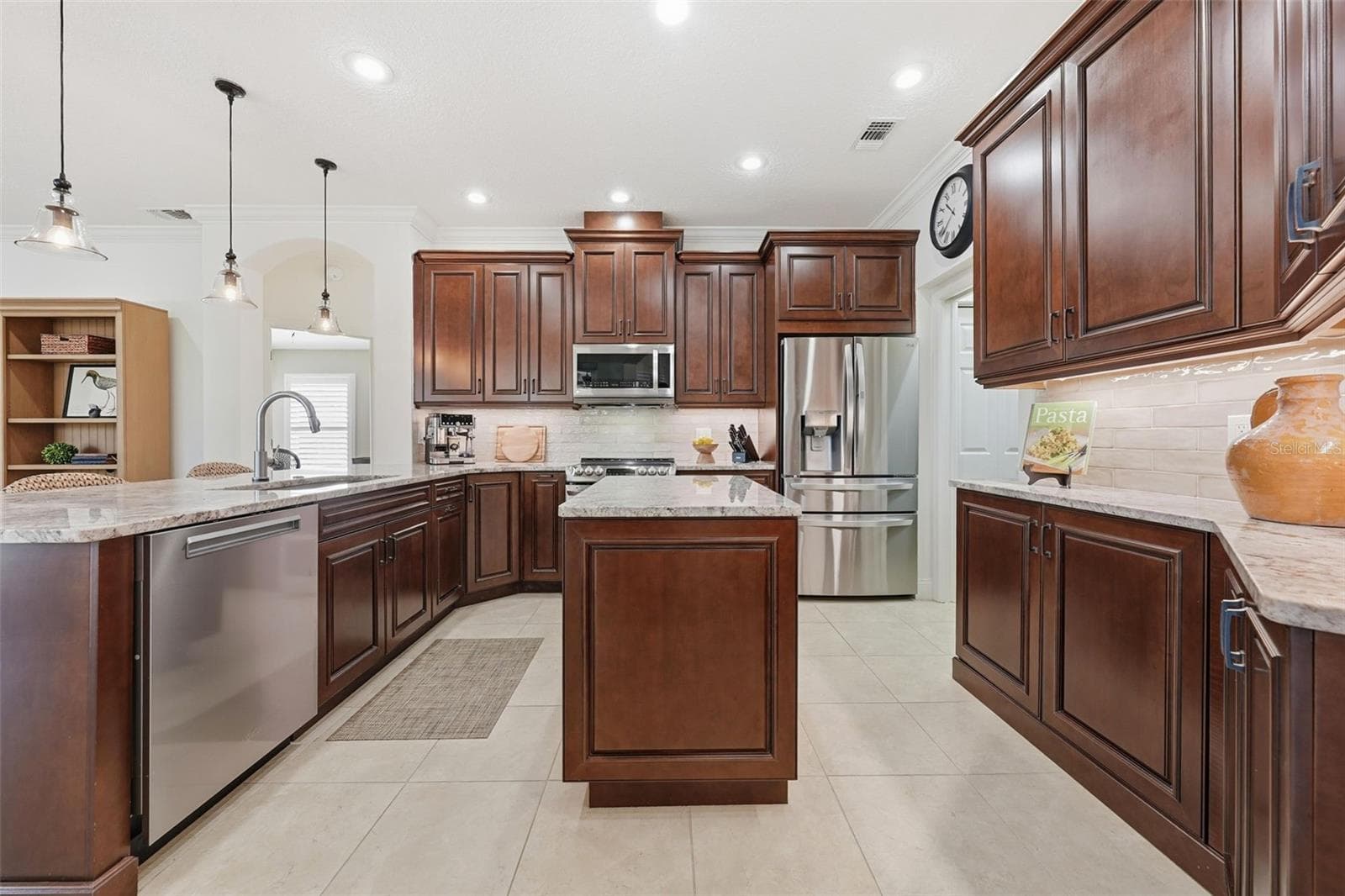 PENDANT LIGHTS AND CENTER ISLAND - 13850 BLUEWATER CIR, ORLANDO
