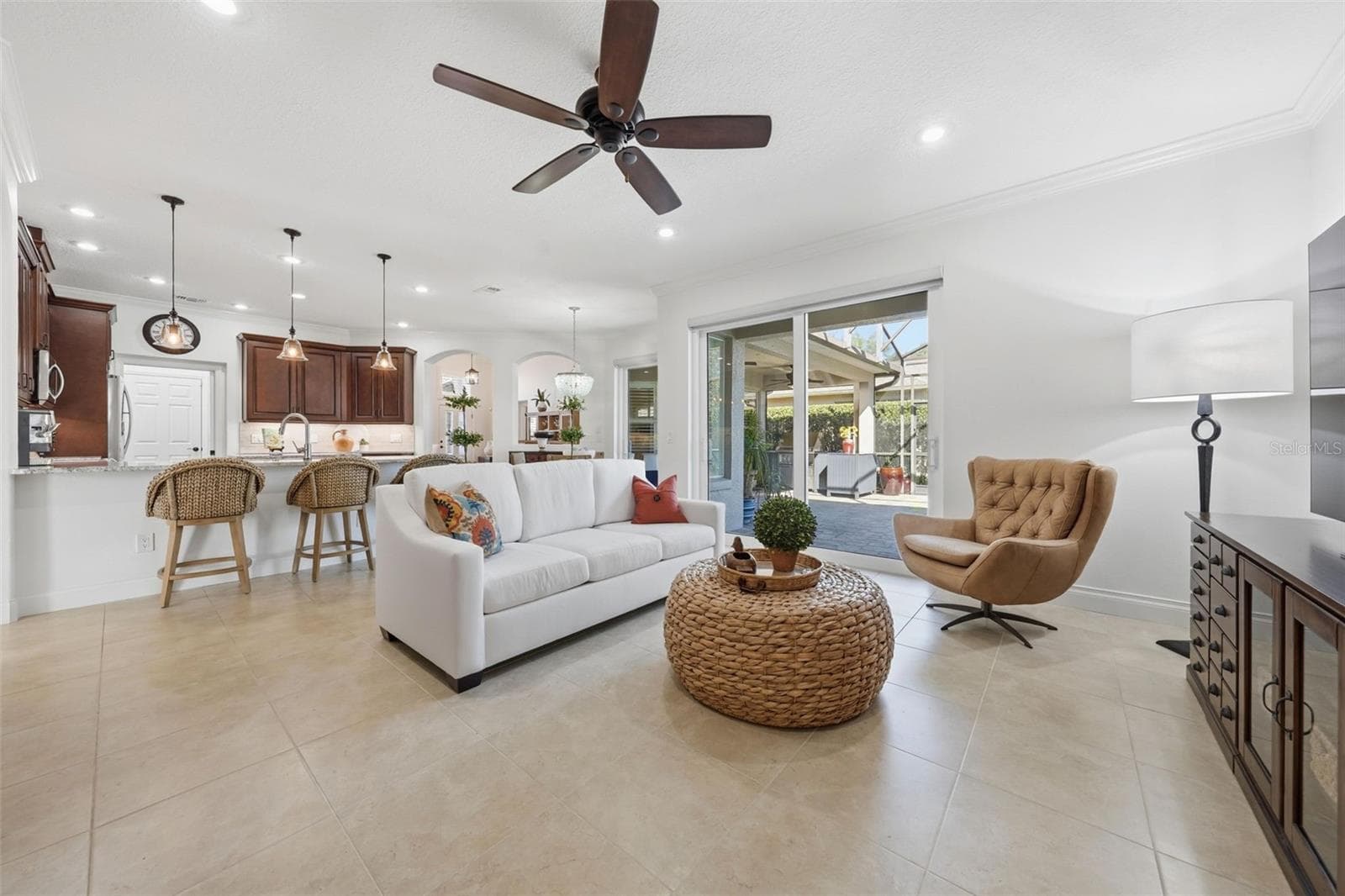 FAMILY ROOM WITH NEW SLIDING DOORS WITH MOTORIZED BLINDS - 13850 BLUEWATER CIR, ORLANDO